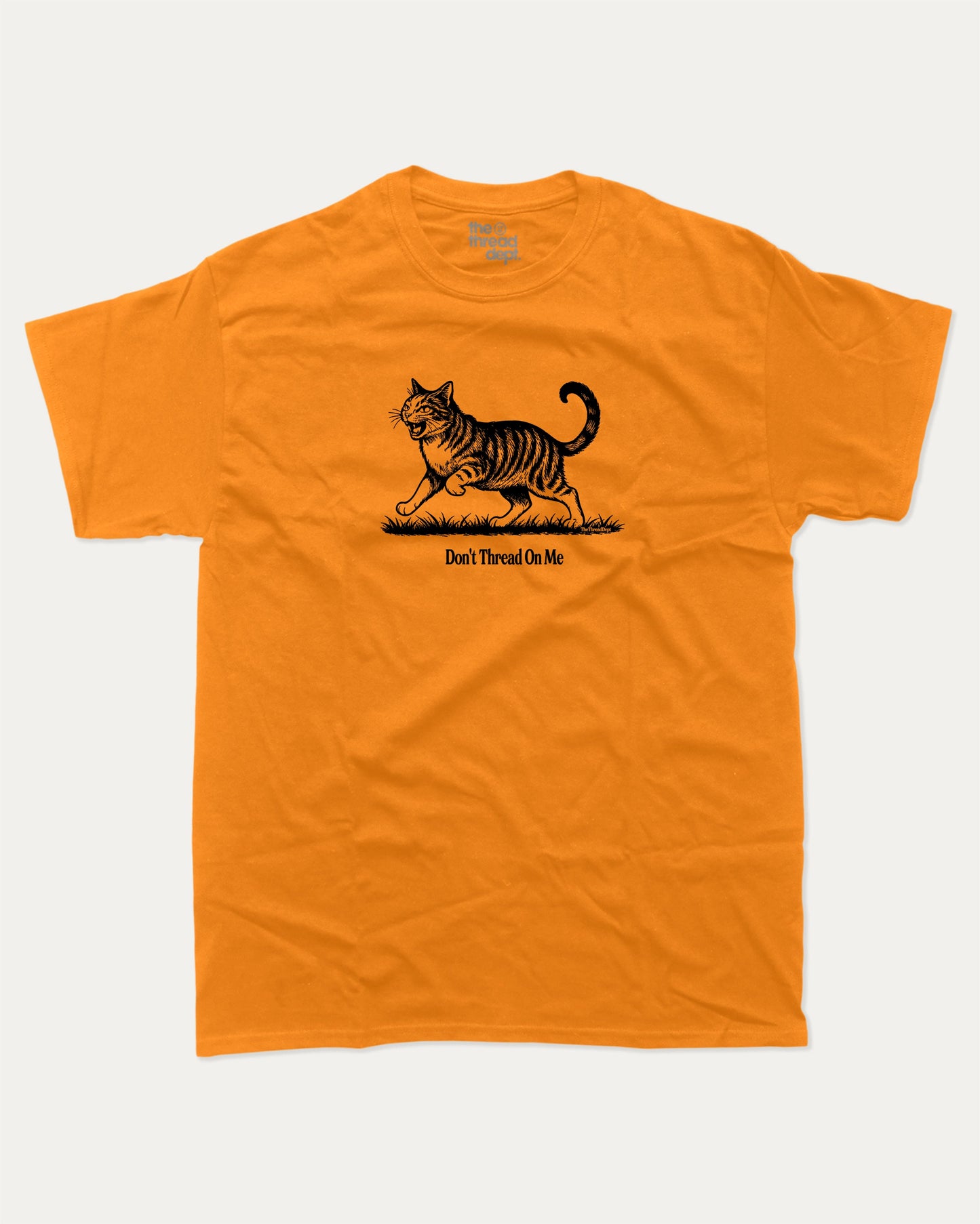 Don't Thread On Me Cat graphic t-shirt, perfect for adults. A must-have funny tee, funny cat shirt, unique gift idea. Orange.