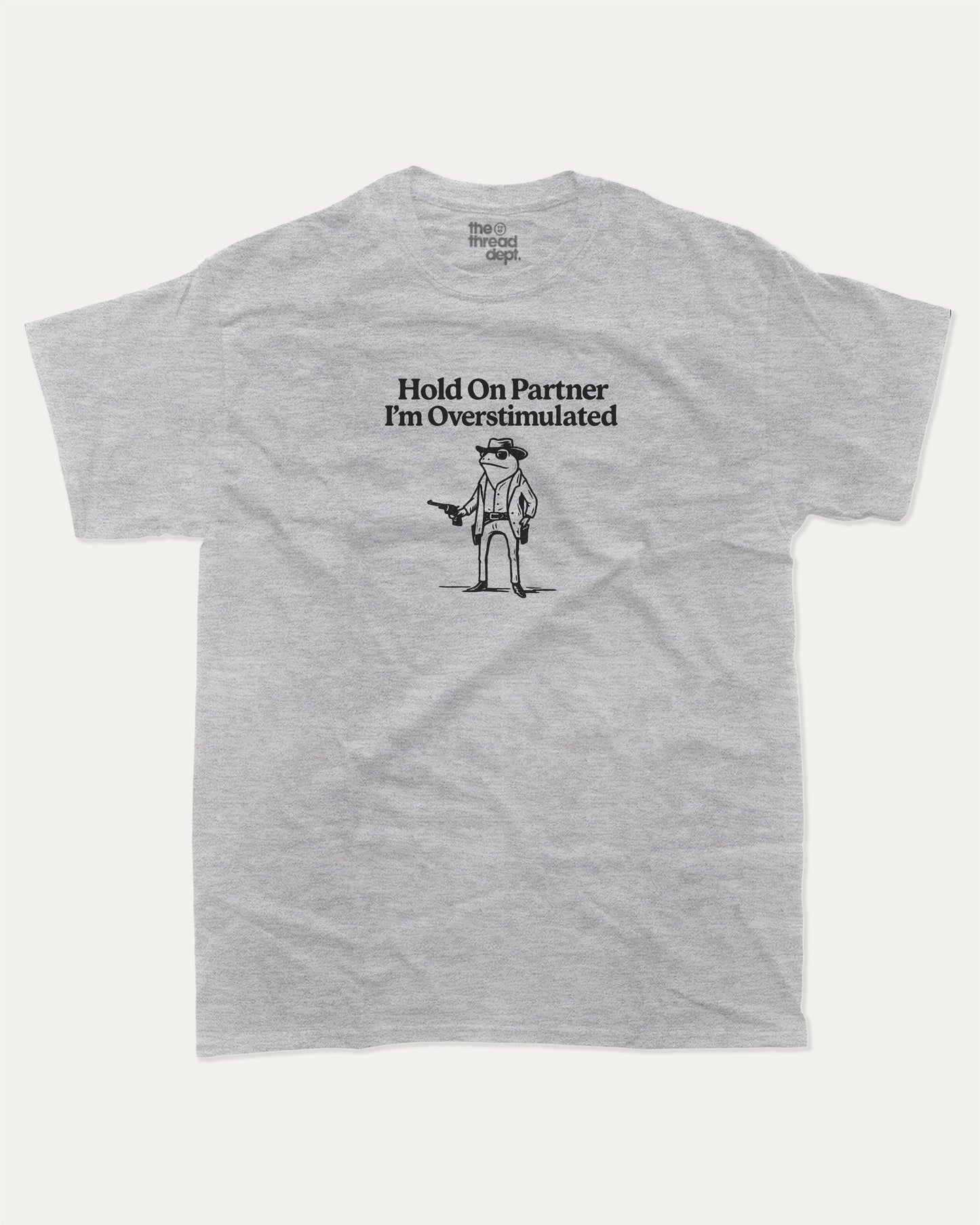 Hold On Partner I'm Overstimulated graphic t-shirt, perfect for adults. Funny Frogs tee, trending meme shirt, unique gift idea. Heather Grey.