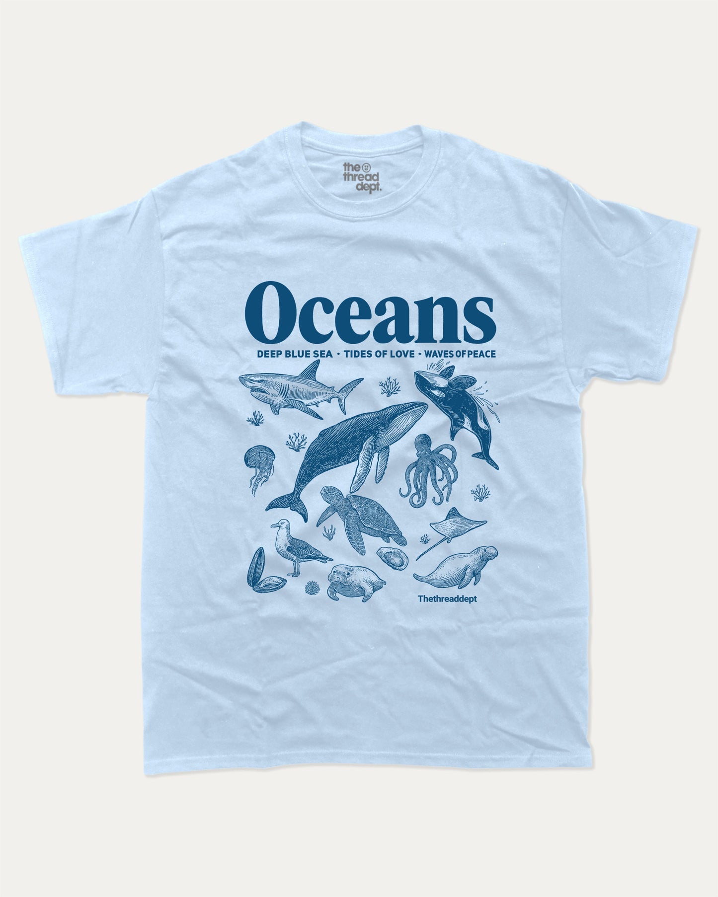Retro Oceans graphic t-shirt, perfect for adults. A must-have sea animal tee, 90s vintage shirt, unique gift idea. Powder Blue.