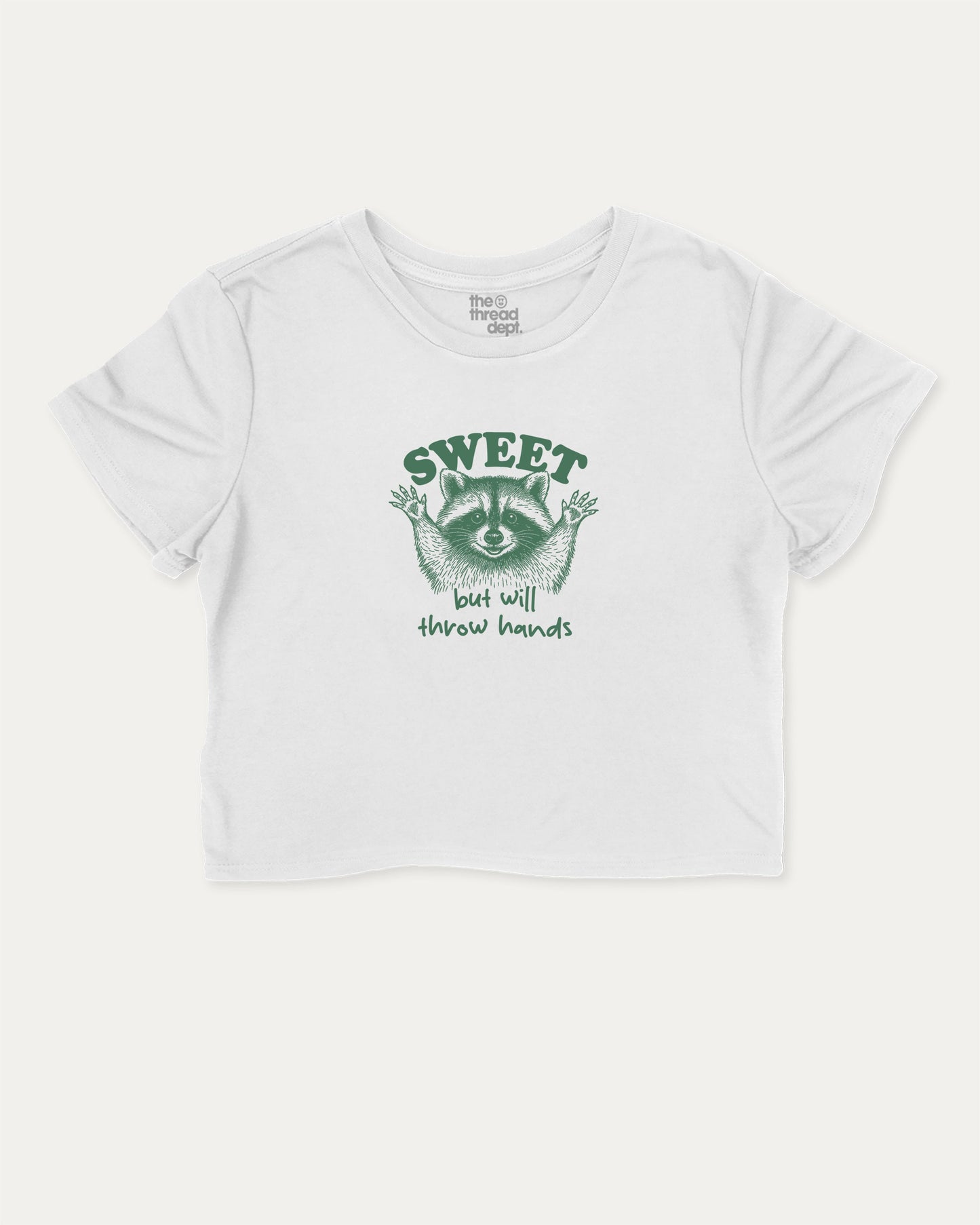 Sweet But Will Throw Hands Raccoon cute and trendy crop tee with raccoon graphic, perfect for women. A must-have cropped aesthetic shirt, ideal for daily outfits and casual days. White crop tee