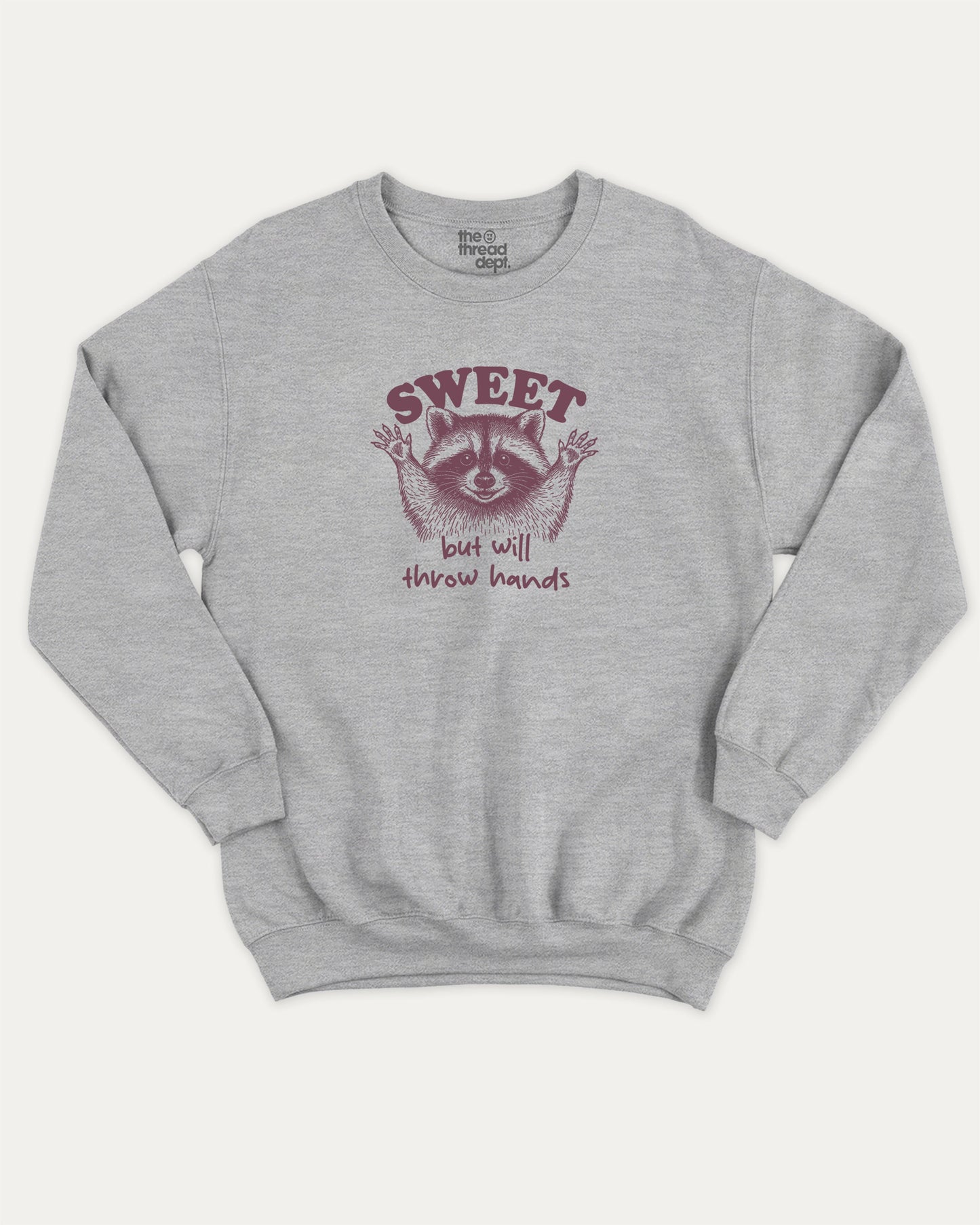 Sweet But Will Throw Hands Raccoon pullover sweatshirt, perfect for adults. Funny raccoon graphic pullover, comfy cold-weather wear, bold casual look. Heather Grey sweater