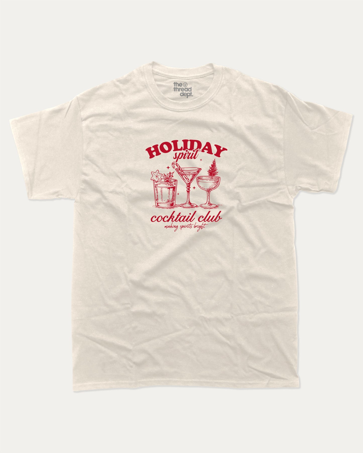 Holiday Spirit Cocktail Club graphic tee with bold and humorous print, funny and trendy graphic. Christmas Gift T shirt, X-mas Graphic T shirt, Drinks lover T shirt, Perfect for adults and gift-giving. Cream shirt.