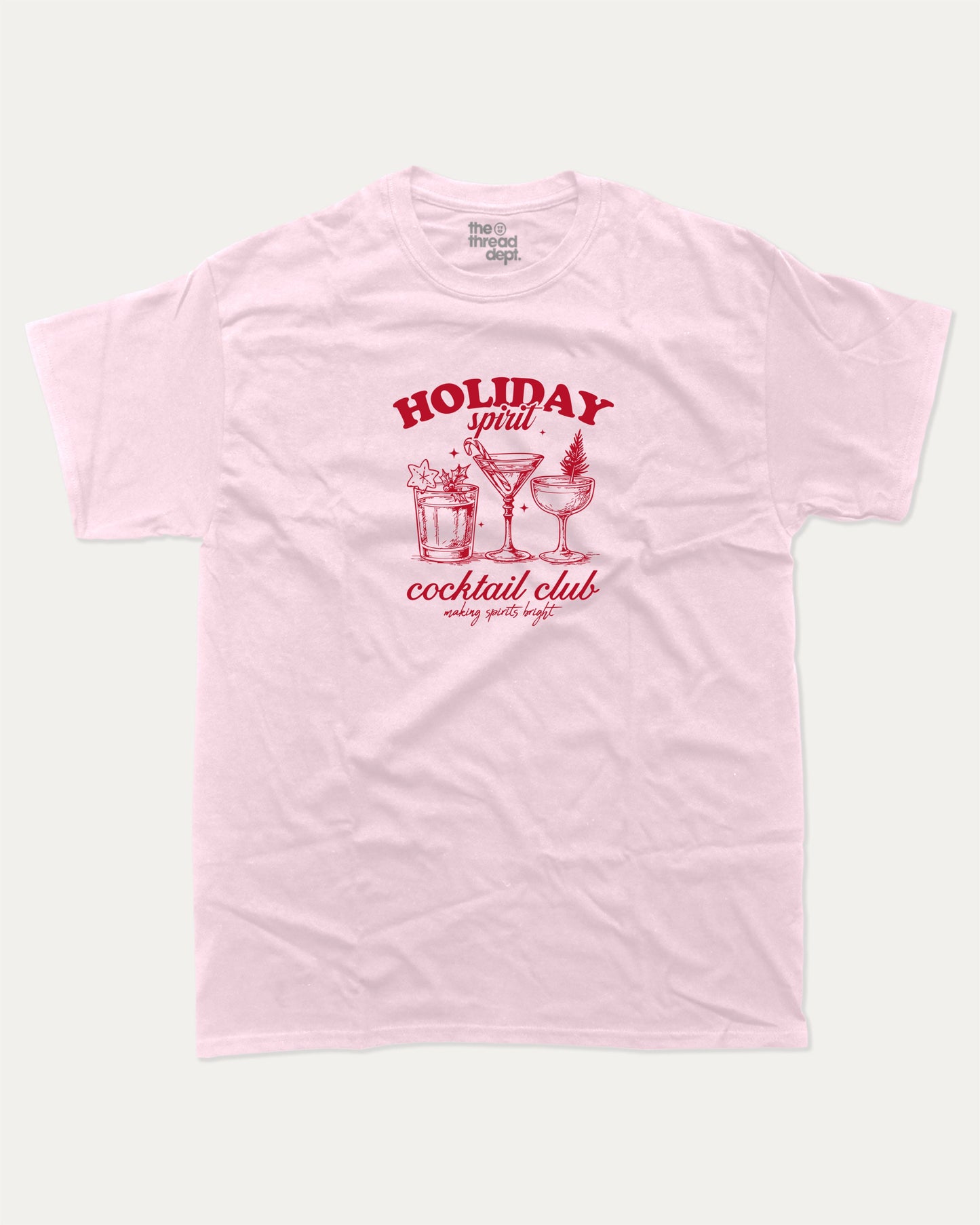 Holiday Spirit Cocktail Club graphic tee with bold and humorous print, funny and trendy graphic. Christmas Gift T shirt, X-mas Graphic T shirt, Drinks lover T shirt, Perfect for adults and gift-giving. Pink shirt.
