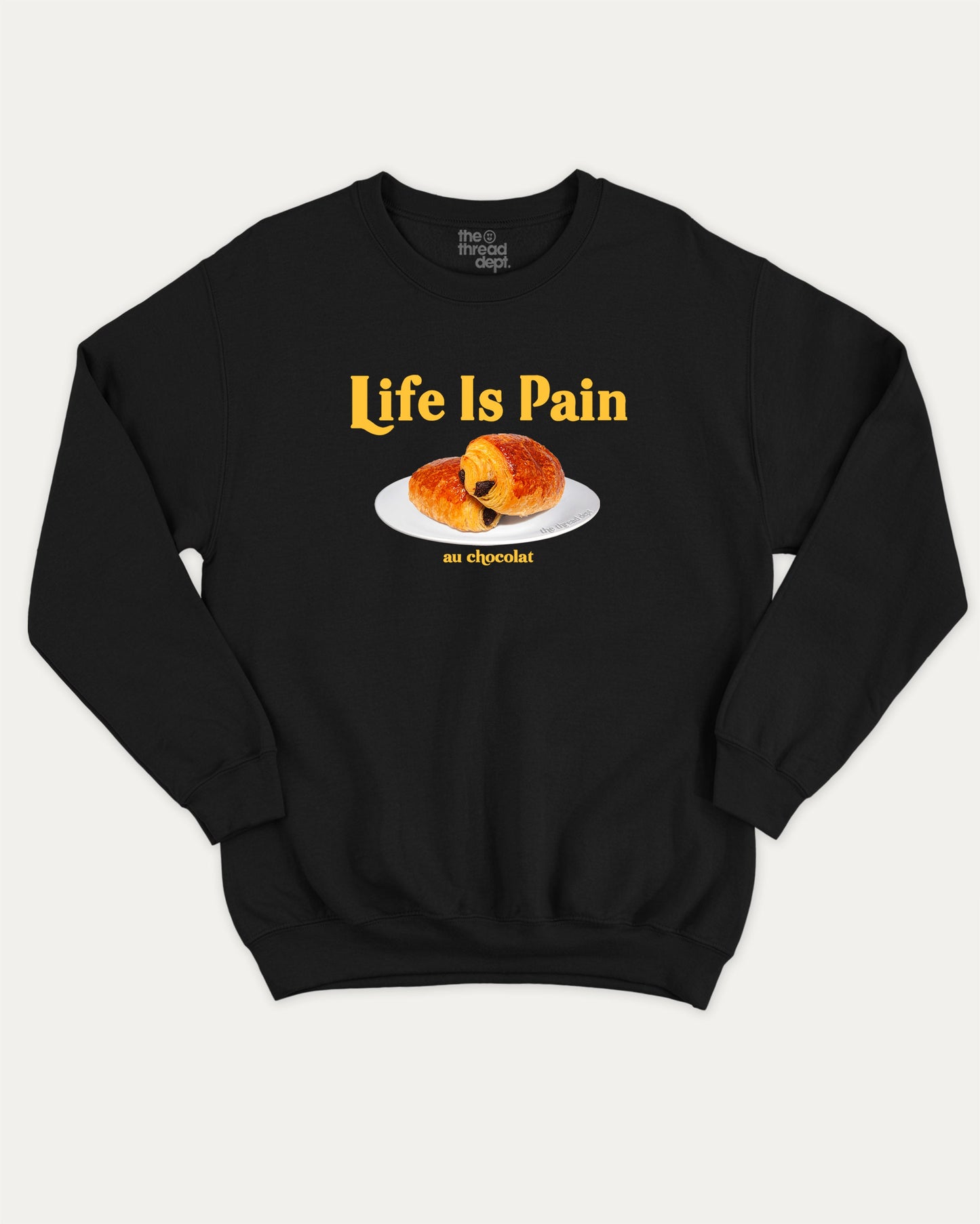 Life Is Pain Au Chocolat pullover sweatshirt, perfect for adults. Funny bread graphic pullover, comfy cold-weather wear, bold casual look. Black sweater