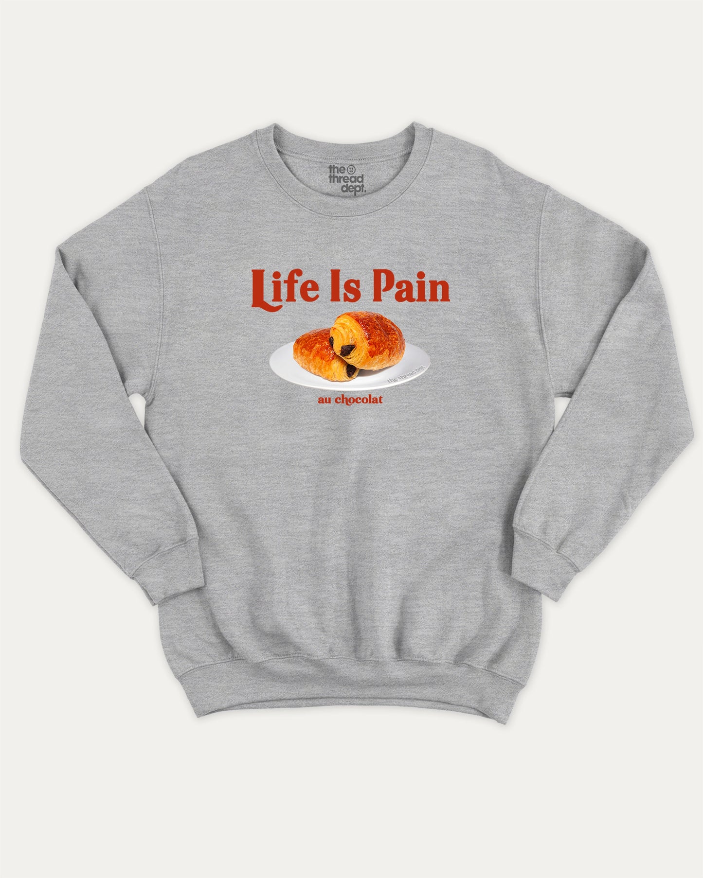 Life Is Pain Au Chocolat pullover sweatshirt, perfect for adults. Funny bread graphic pullover, comfy cold-weather wear, bold casual look. Heather Grey sweater