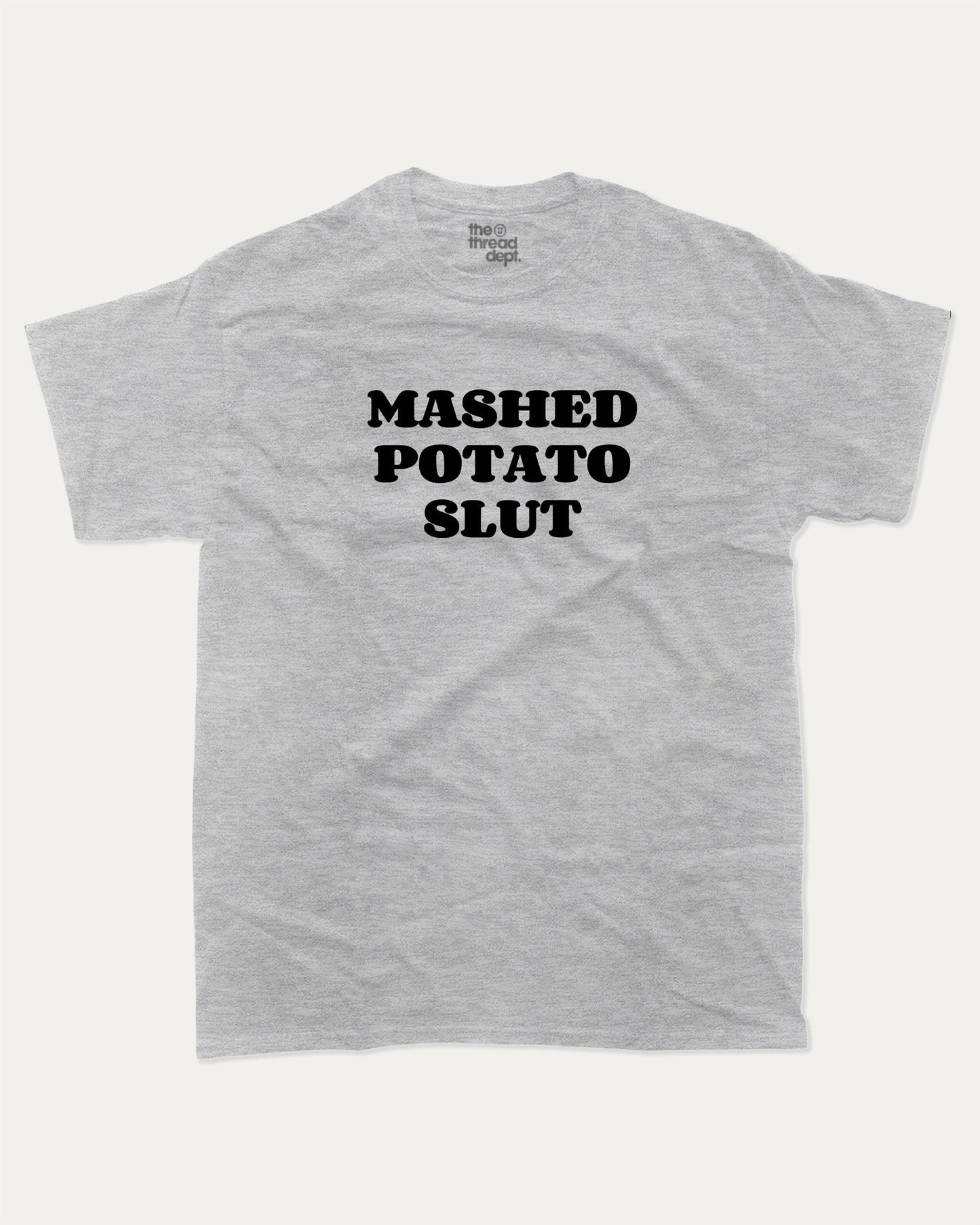 Mashed Potato Slut graphic tee with bold and humorous print, retro mashed potato graphic. Perfect for adults and gift-giving. Heather Grey shirt.