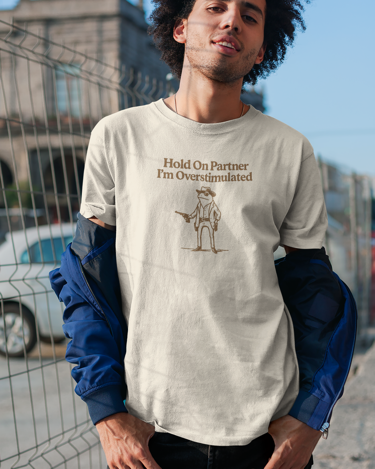 Hold On Partner I'm Overstimulated graphic tee.