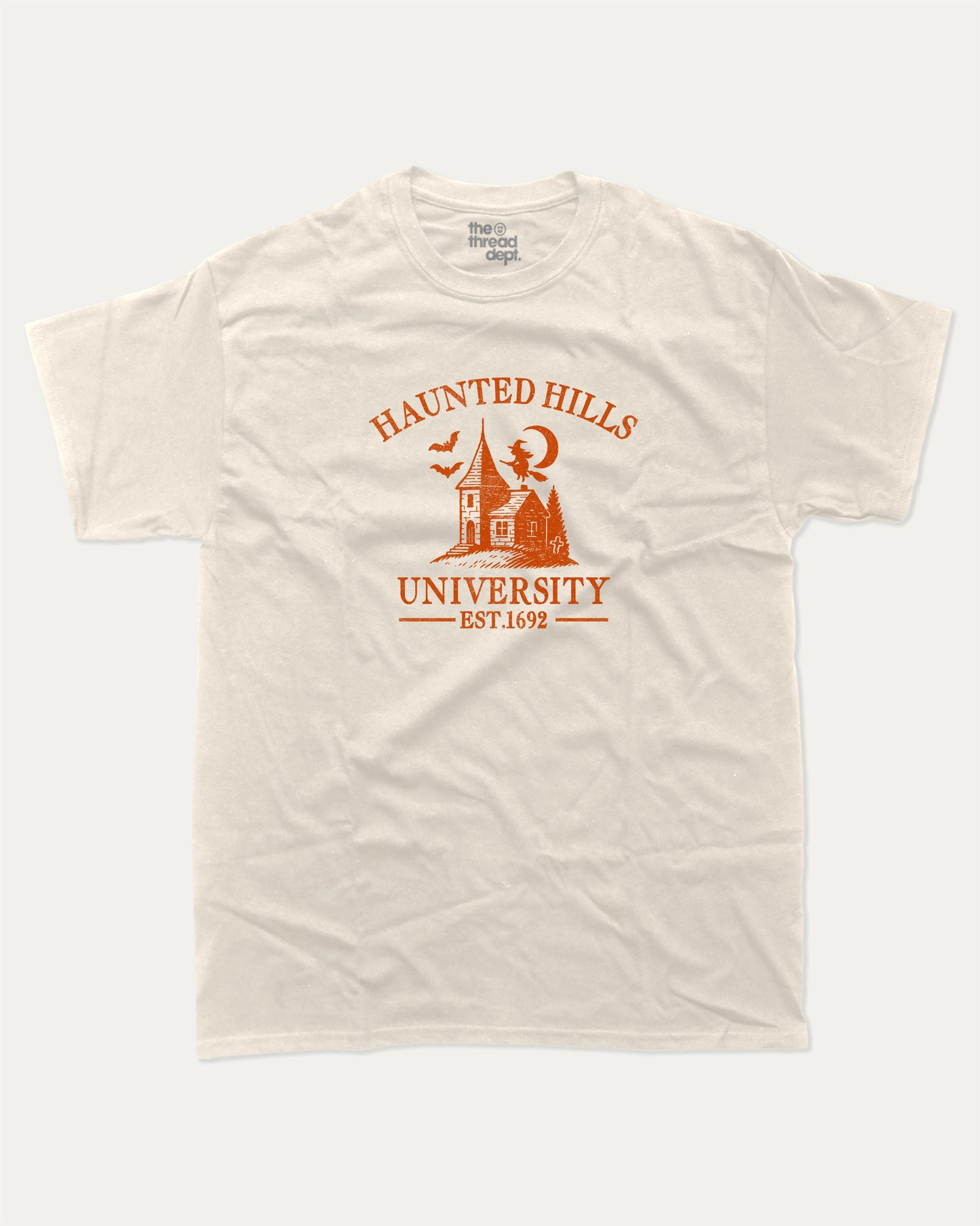 Haunted Hills University graphic tee with bold and humorous print, Halloween Graphic T shirt, Spooky T shirt, Perfect Gift for Halloween Day, funny and trendy graphic. Perfect for adults and gift-giving. Cream shirt.