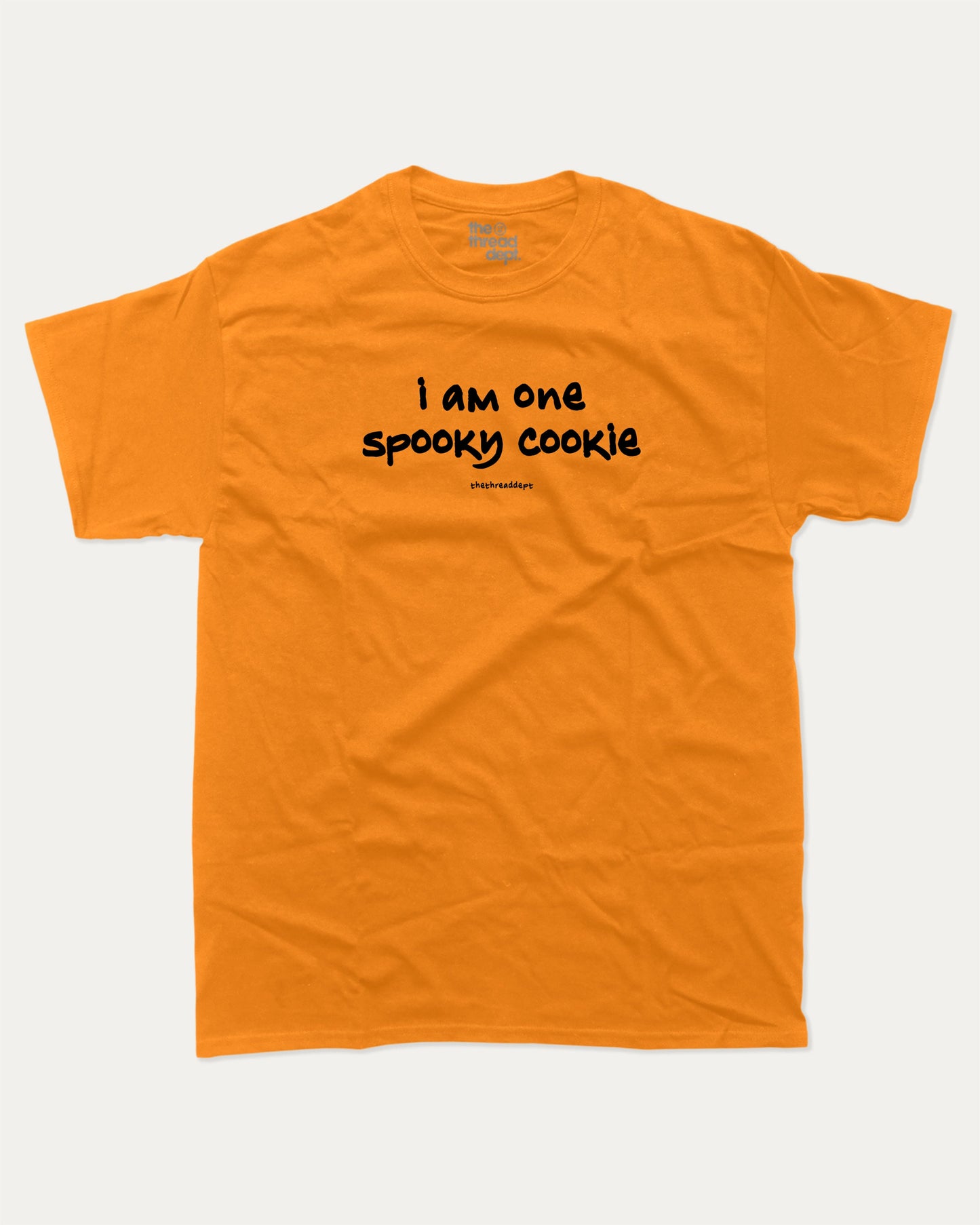 I am one spooky cookie graphic tee with bold and humorous print, Halloween Graphic T shirt, Spooky T shirt, Perfect Gift for Halloween Day, funny and trendy graphic. Perfect for adults and gift-giving. Orange shirt.