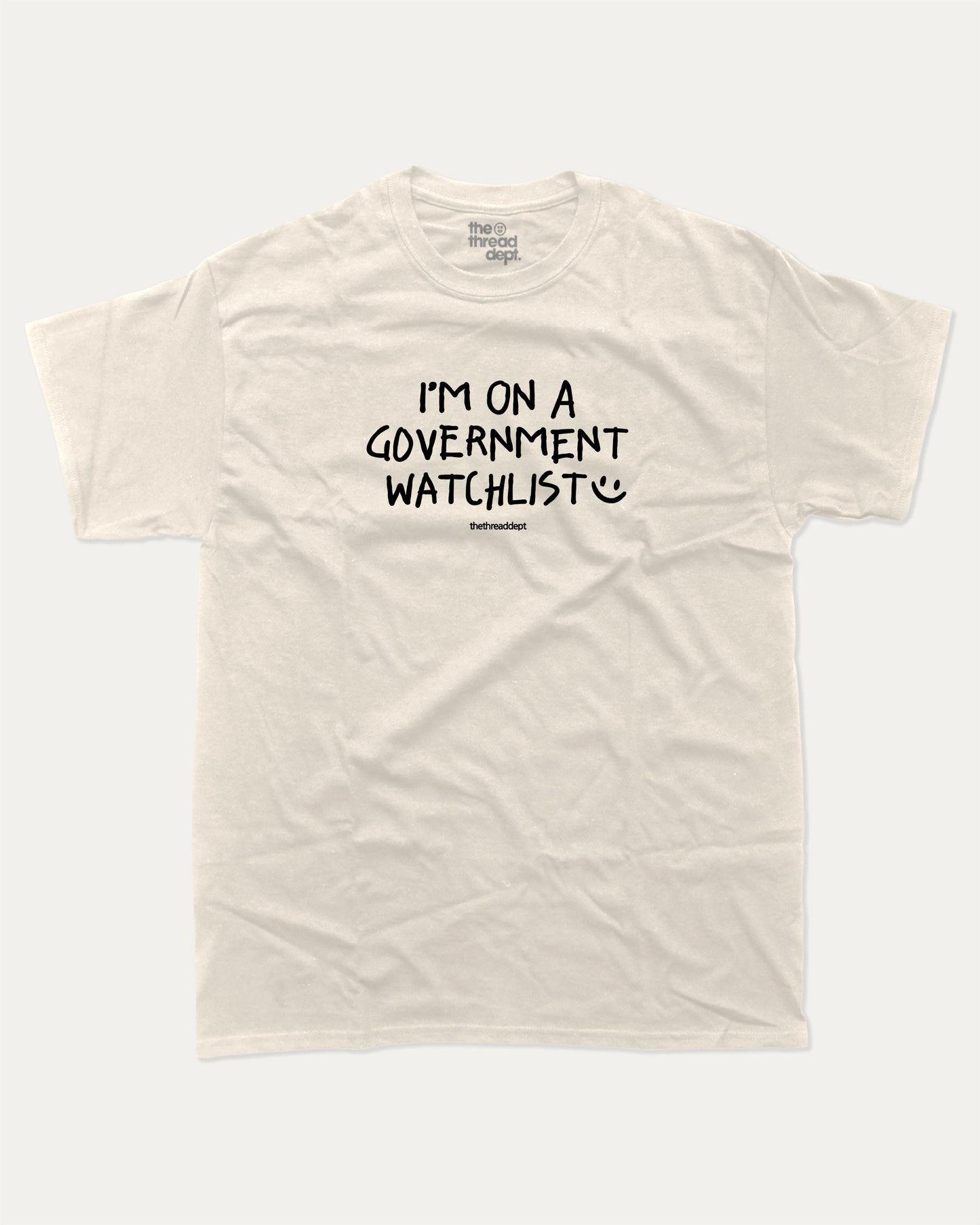 I'm on a government watchlist graphic tee with bold and humorous print, funny and trendy graphic. Perfect for adults and gift-giving. Cream shirt.