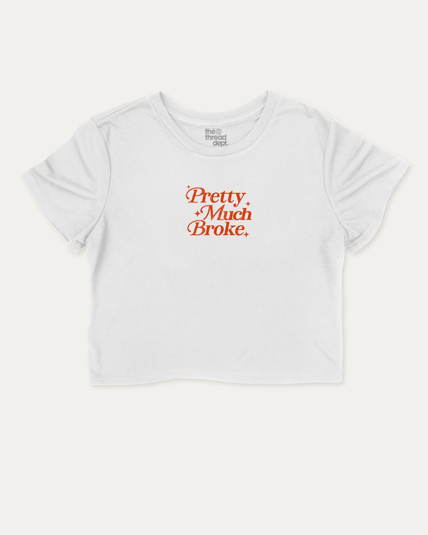 Pretty Much Broke graphic crop tee with funny and trendy slogan print, perfect for women’s casual looks or layering. White crop t-shirt.