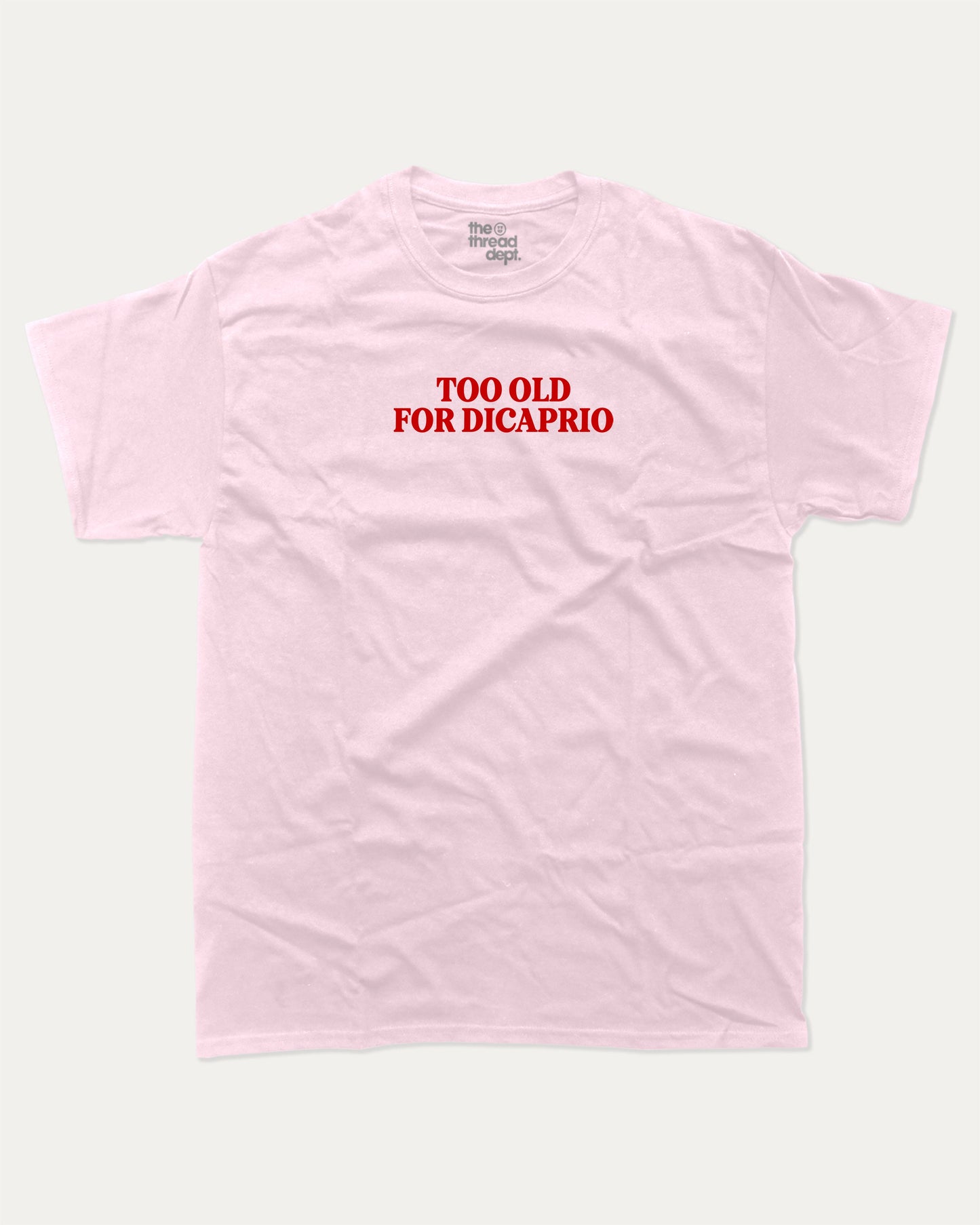 Too Old For Dicaprio graphic tee with bold and humorous print, funny and trendy graphic. Perfect for adults and gift-giving. Pink shirt.