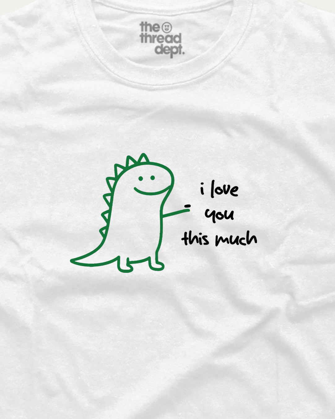 White t-shirt with a green dinosaur graphic and text 'i love you this much' on a white background.