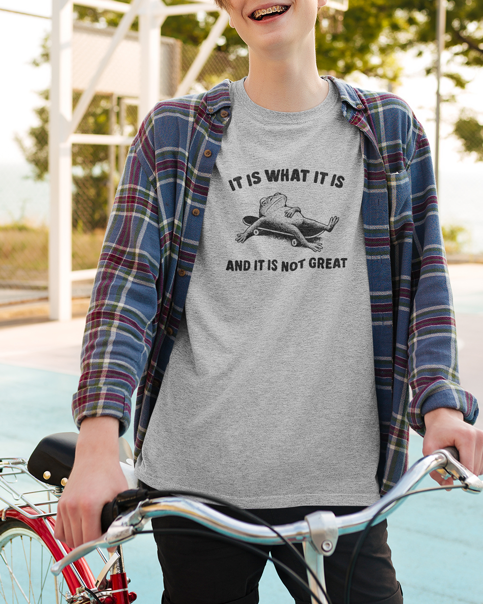 It Is What It Is And It Is Not Great graphic t-shirt, perfect for adults. A must-have funny Frog t-shirt.