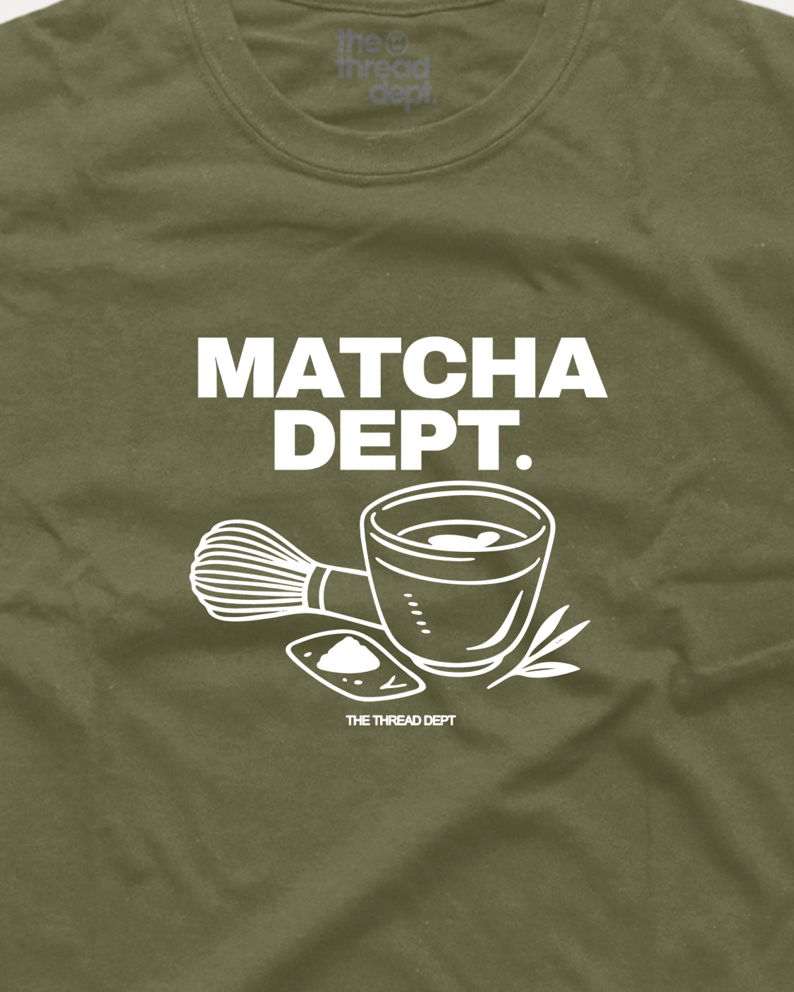 Green t-shirt with 'Matcha Dept.' design featuring a cup and whisk on an olive green background.