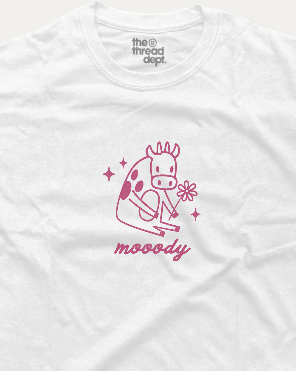 White t-shirt with pink giraffe graphic and 'moody' text on a white background