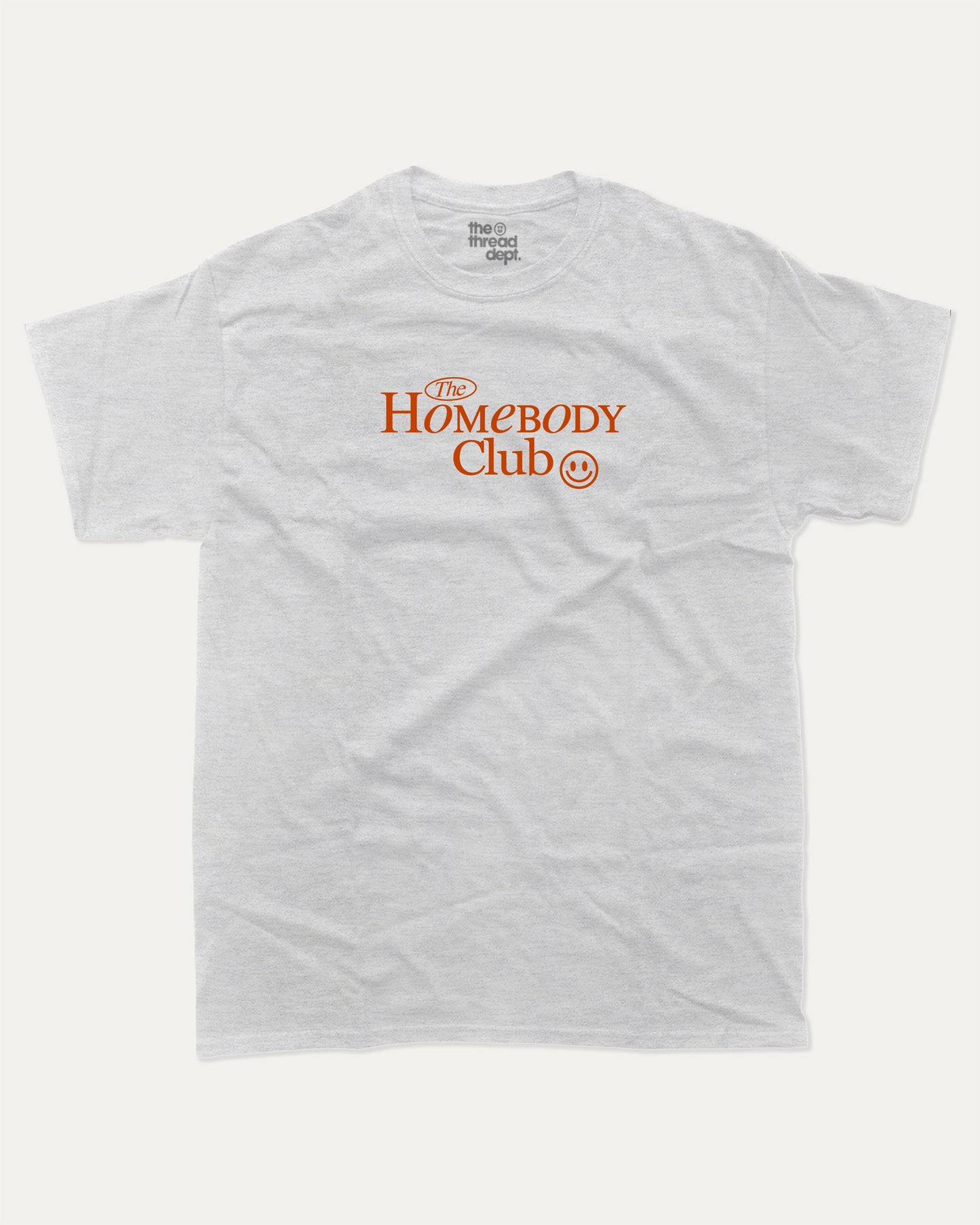 The Homebody Club graphic tee with bold and humorous print, funny and trendy graphic. Vintage Inspired Graphic t shirt, Retro Inspired Graphic T shirt, Perfect for adults and gift-giving. Ash Grey shirt.