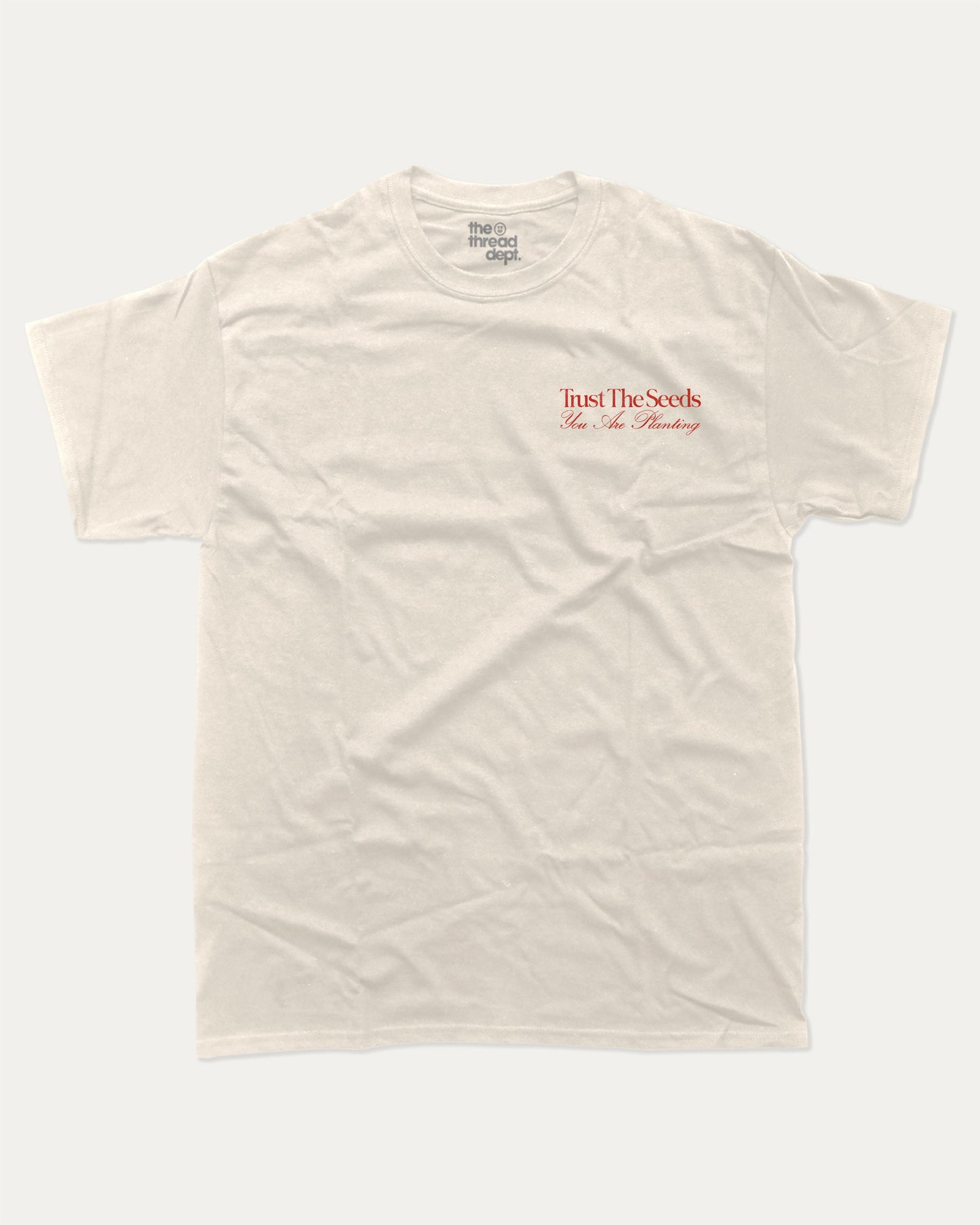Trust The Seeds graphic t-shirt, Vintage Inspired Graphic T shirt, Retro Inspired Graphic T shirt, . A must-have funny tee, trending meme shirt, unique gift idea. Cream.