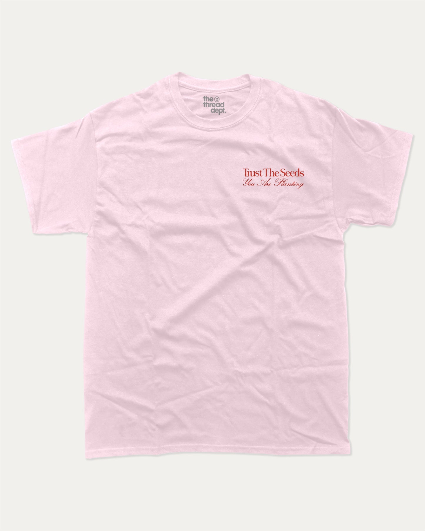 Trust The Seeds graphic t-shirt, Vintage Inspired Graphic T shirt, Retro Inspired Graphic T shirt, . A must-have funny tee, trending meme shirt, unique gift idea. Pink.