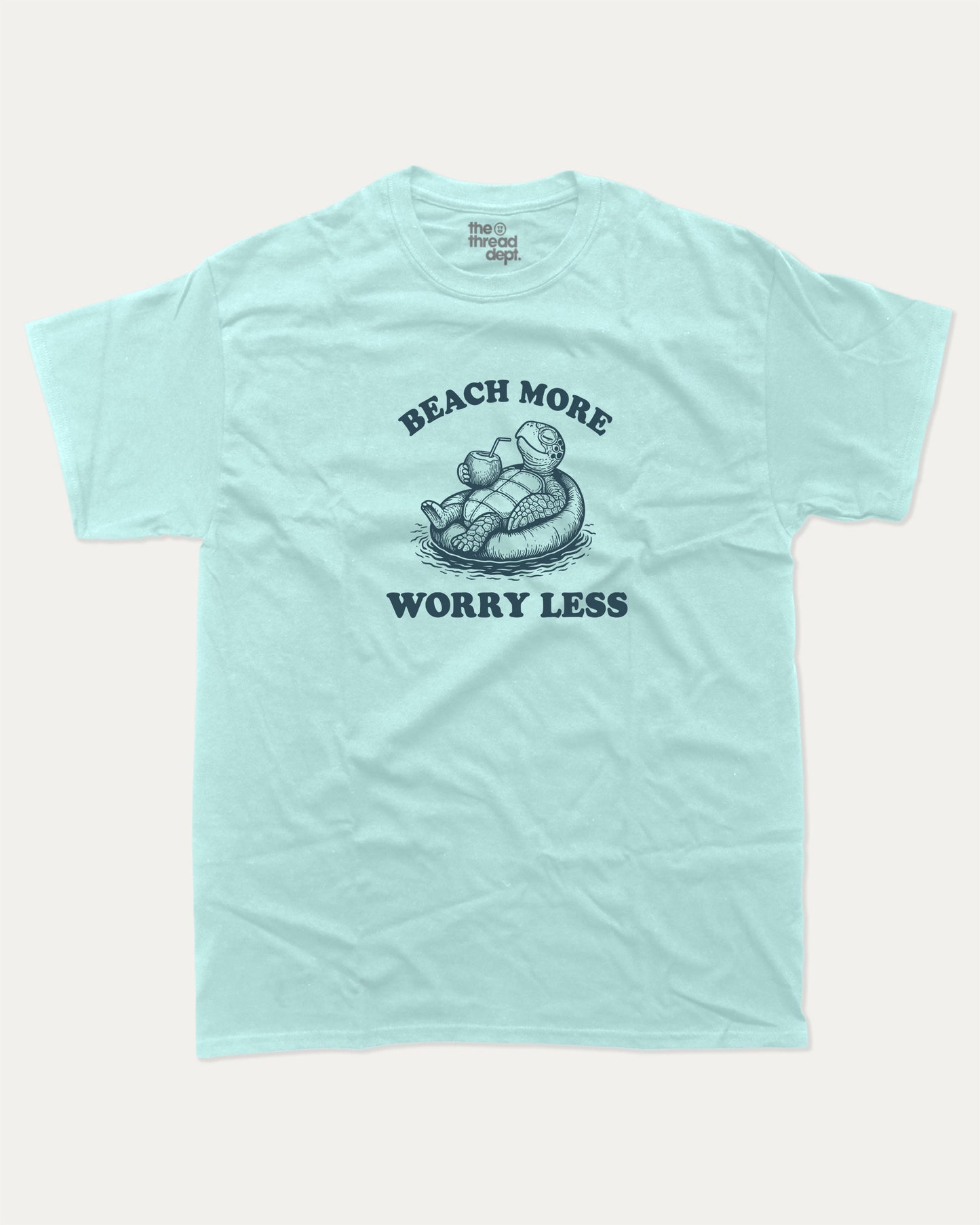 Beach More Worry Less graphic t-shirt, perfect for adults. A must-have funny summer tee, trending meme shirt, unique gift idea. Celadon.
