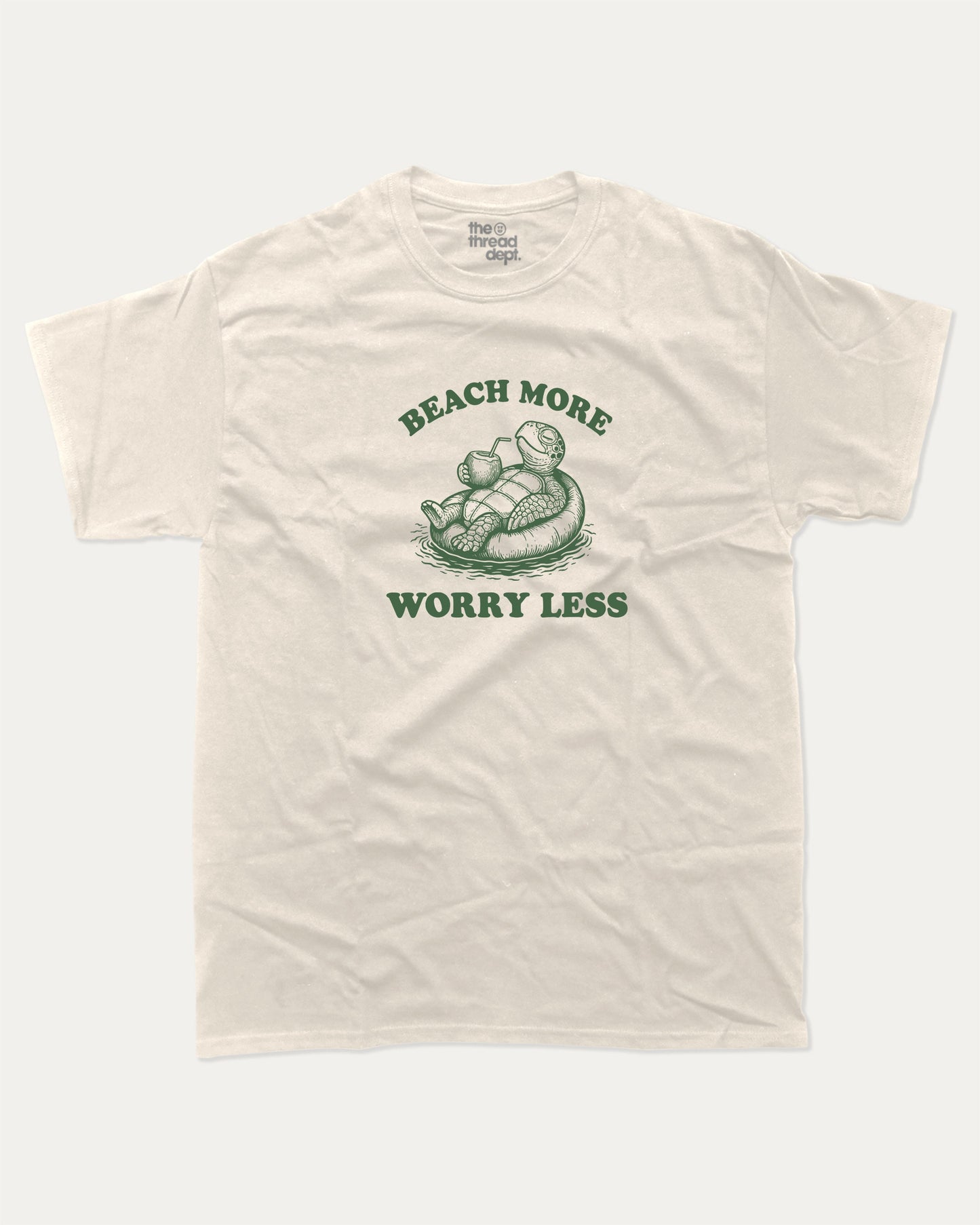 Beach More Worry Less graphic t-shirt, perfect for adults. A must-have funny summer tee, trending meme shirt, unique gift idea. Cream.