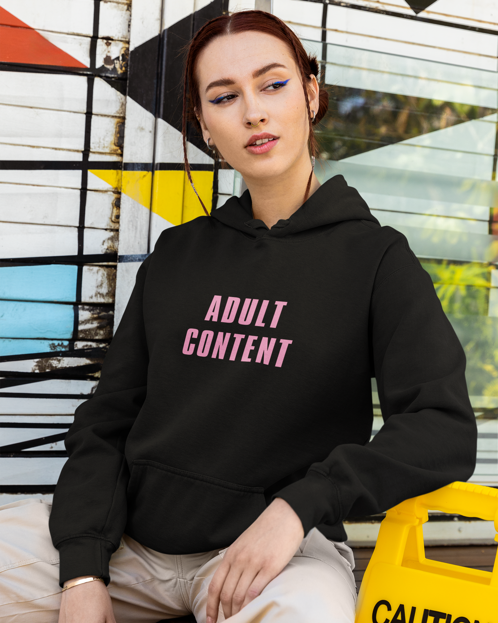 Adult Content graphic hoodie with retro and trendy artwork, casual streetwear with bold personality. Great for adults and gifting. Black hoodie.