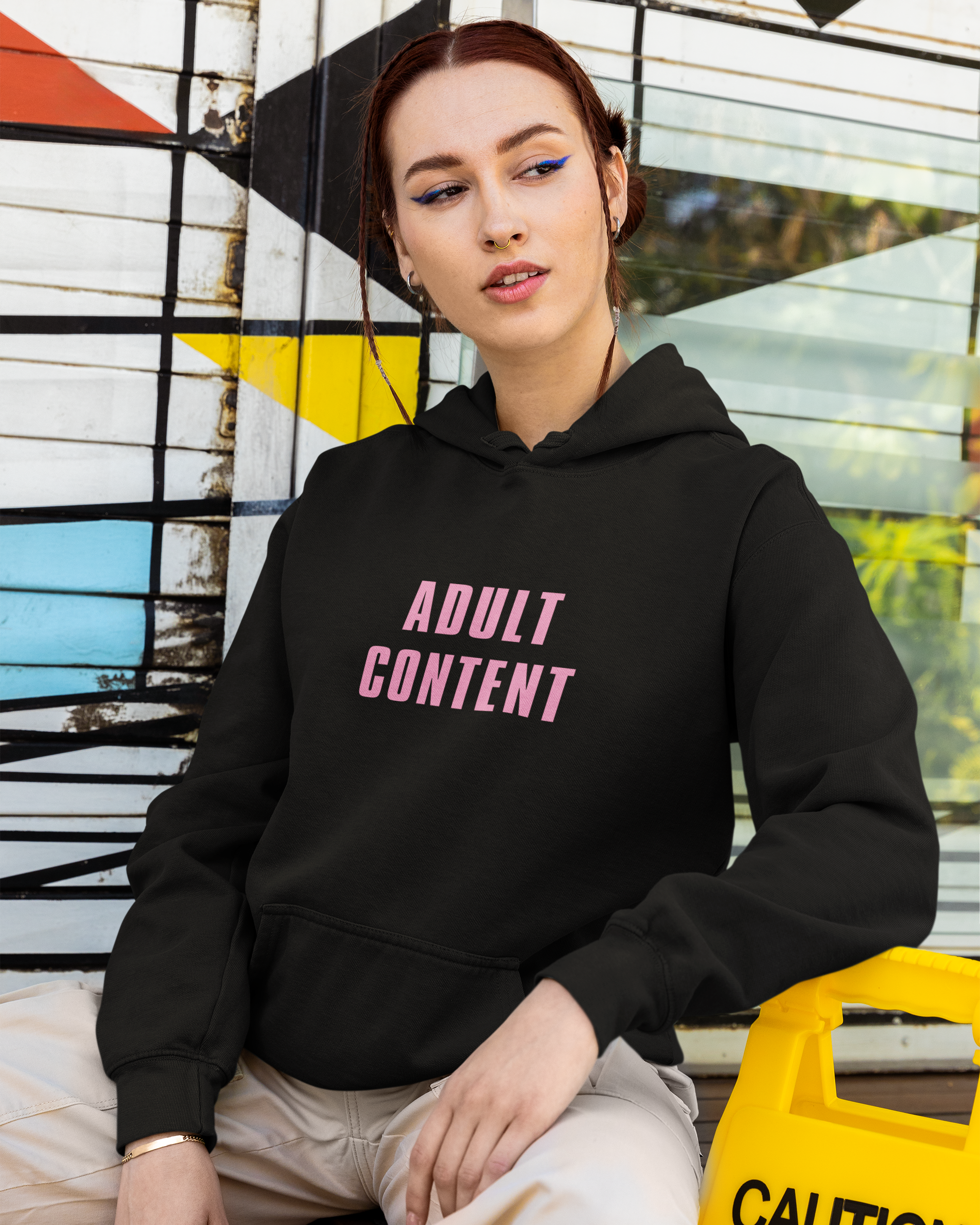 Adult Content graphic hoodie with retro and trendy artwork, casual streetwear with bold personality. Great for adults and gifting. Black hoodie.