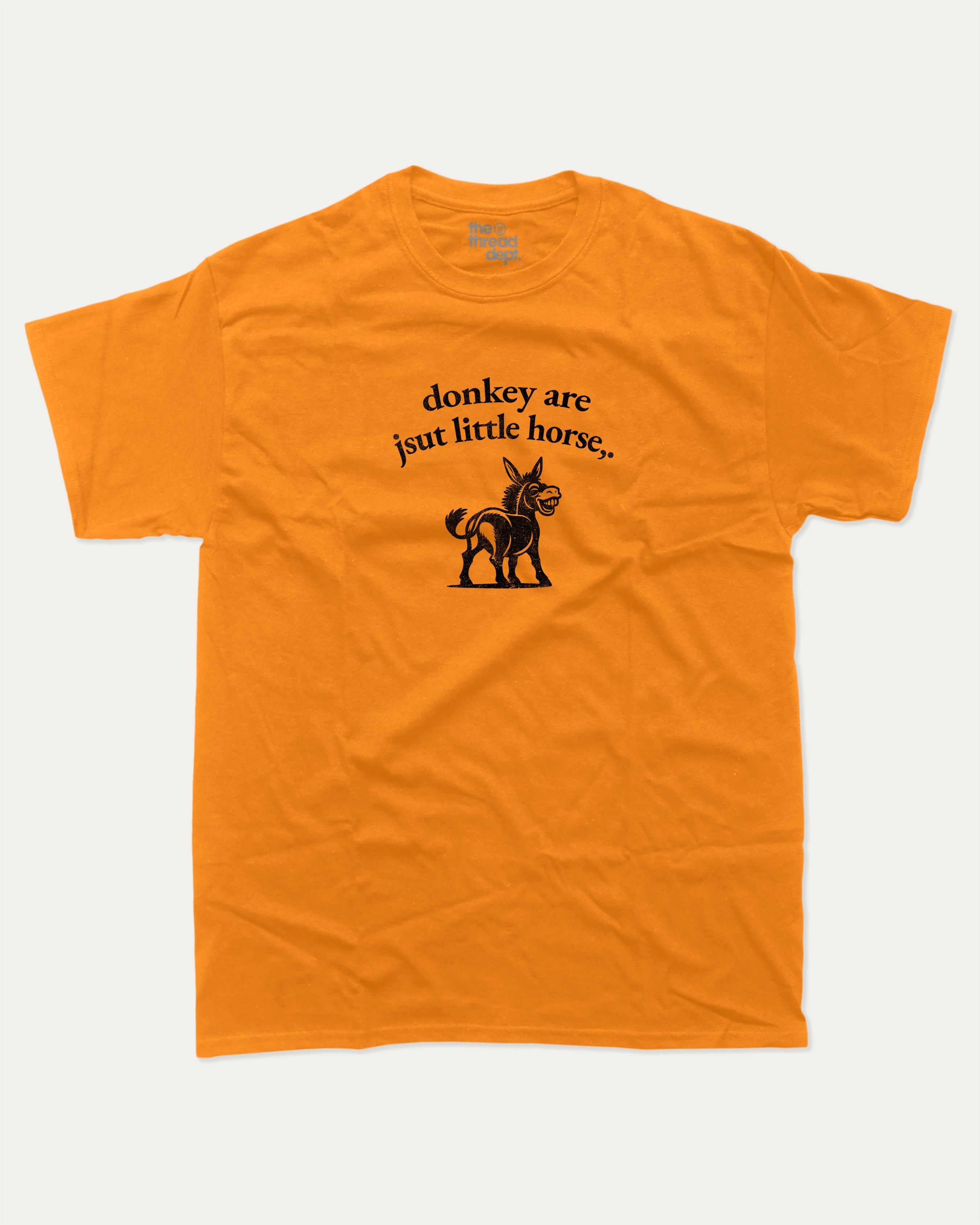 donkey are jsut little horse graphic tee with bold and humorous print, funny and trendy graphic. Perfect for adults and gift-giving. Orange shirt.
