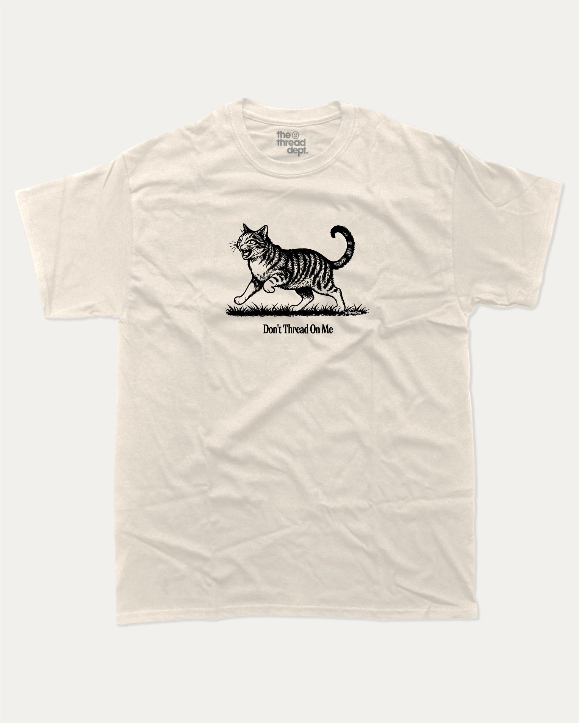 Don't Thread On Me Cat graphic t-shirt, perfect for adults. A must-have funny tee, funny cat shirt, unique gift idea. Cream.