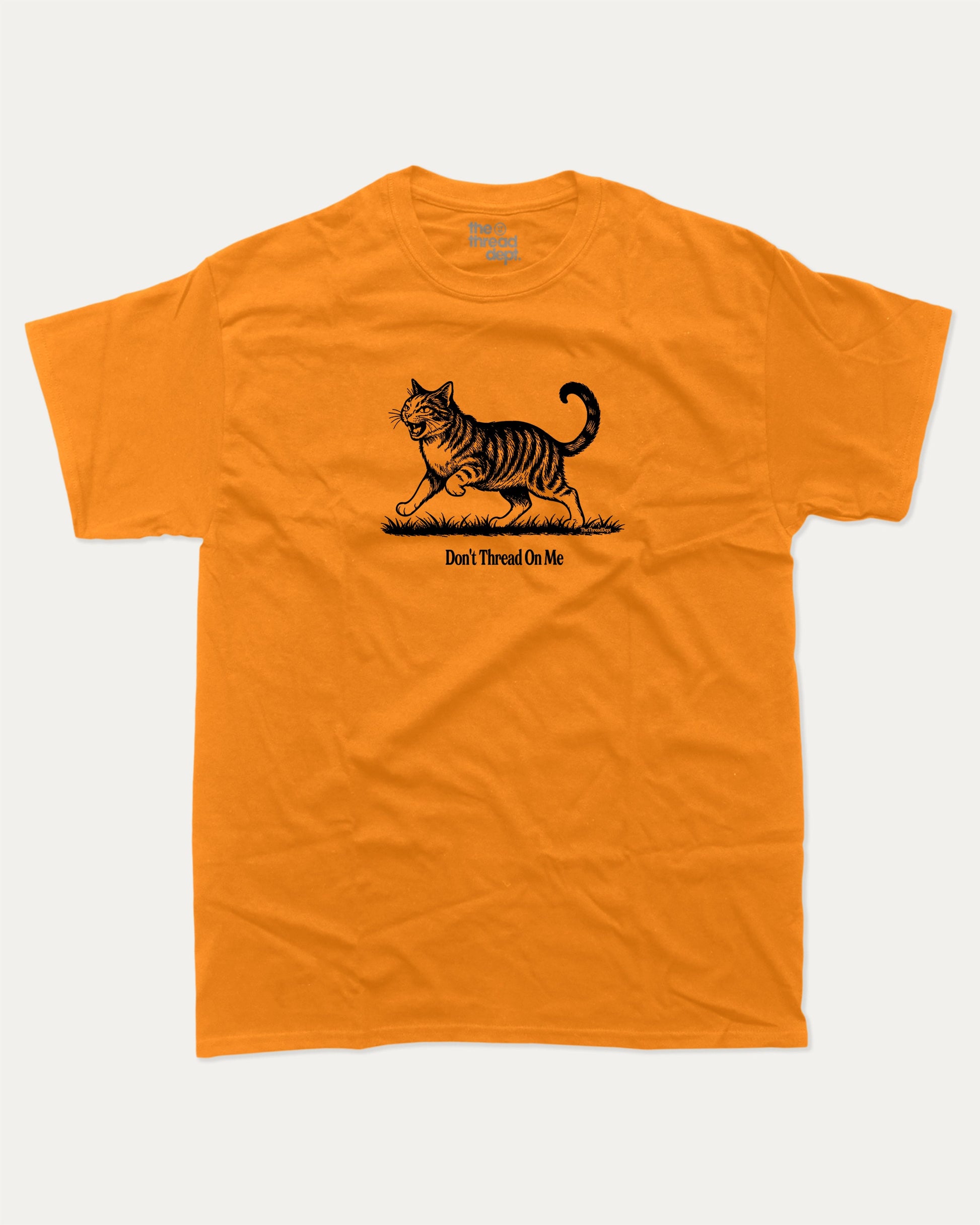 Don't Thread On Me Cat graphic t-shirt, perfect for adults. A must-have funny tee, funny cat shirt, unique gift idea. Orange.