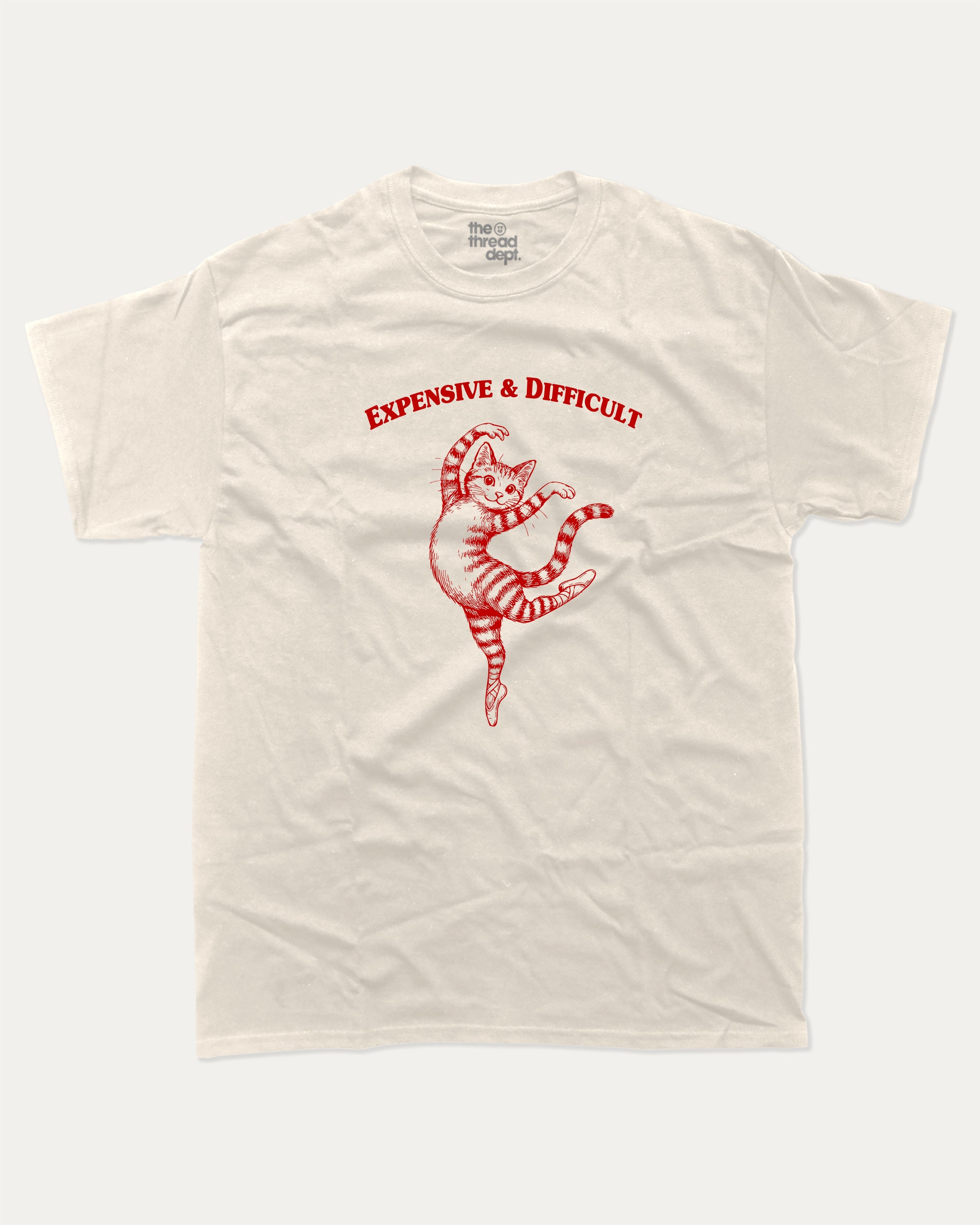 Expensive and Difficult graphic tee with bold and humorous print, Perfect Gift for Cat Lovers, Funny Cat Graphic tee, funny and trendy graphic. Perfect for adults and gift-giving. Cream shirt.