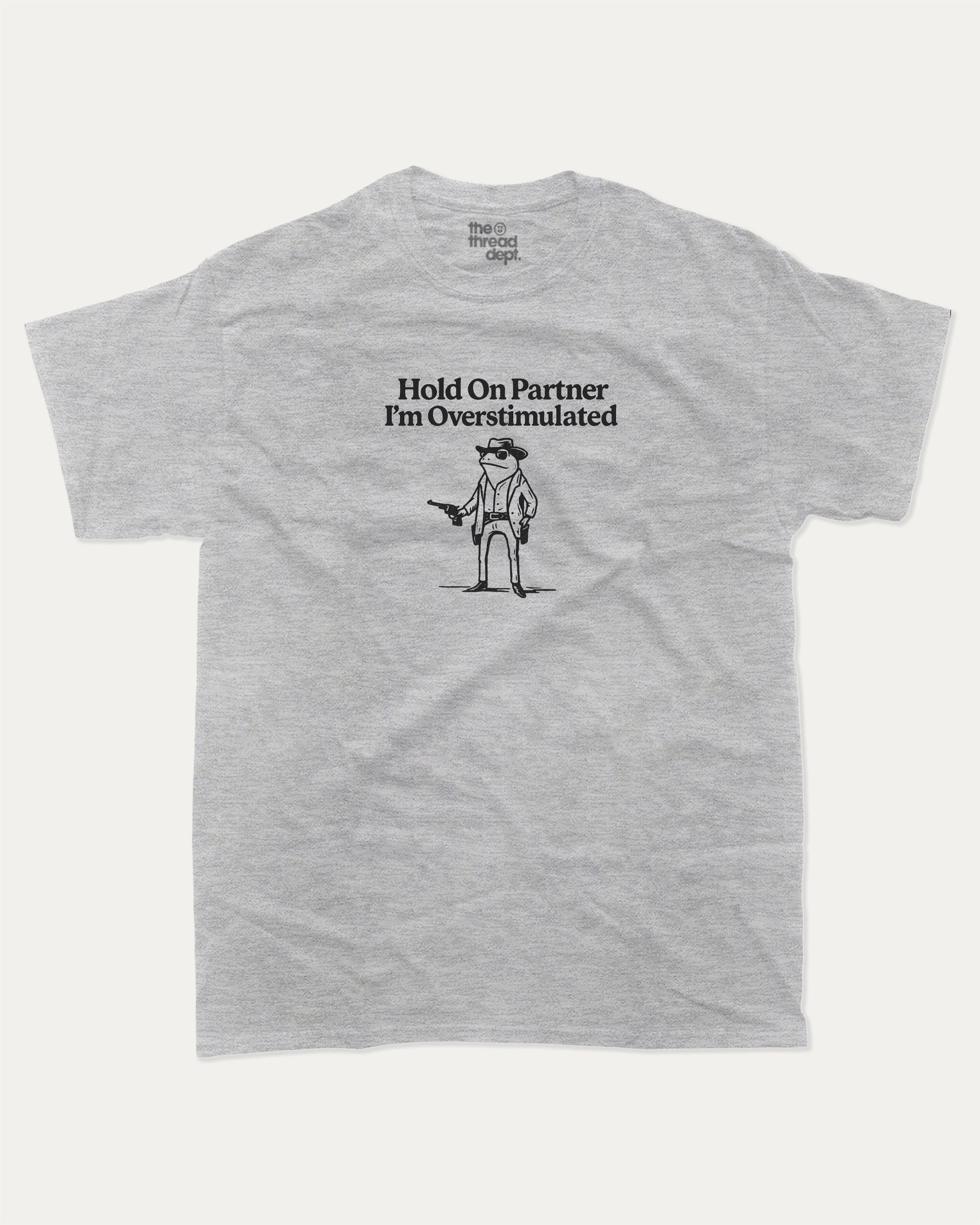 Hold On Partner I'm Overstimulated graphic t-shirt, perfect for adults. Funny Frogs tee, trending meme shirt, unique gift idea. Heather Grey.