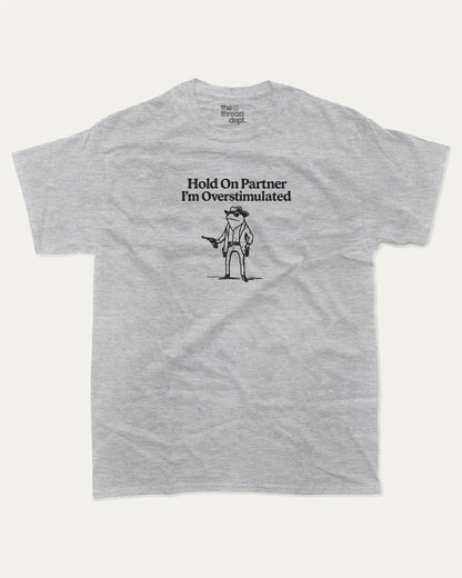 Hold On Partner I'm Overstimulated graphic t-shirt, perfect for adults. Funny Frogs tee, trending meme shirt, unique gift idea. Heather Grey.