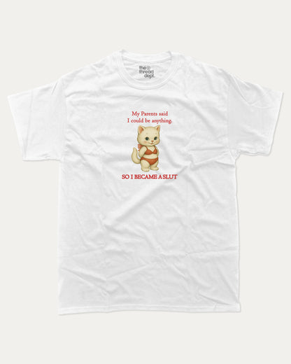 White t-shirt with a cartoon cat i became a slut graphic and text on a white background