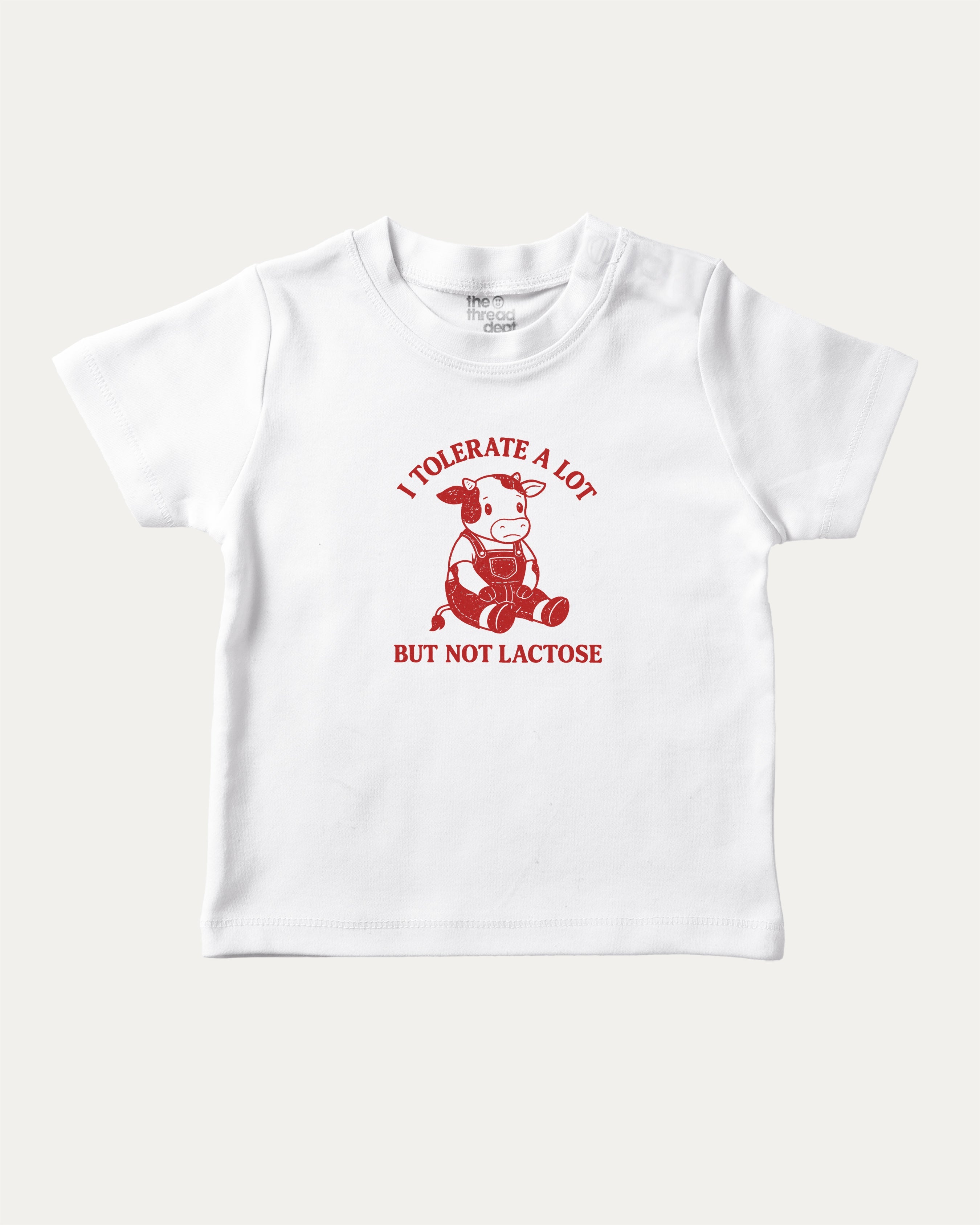 I Tolerate A Lot But Not Lactose graphic tee with cute cow print, funny and trendy graphic. Perfect for adults and gift-giving. White shirt.