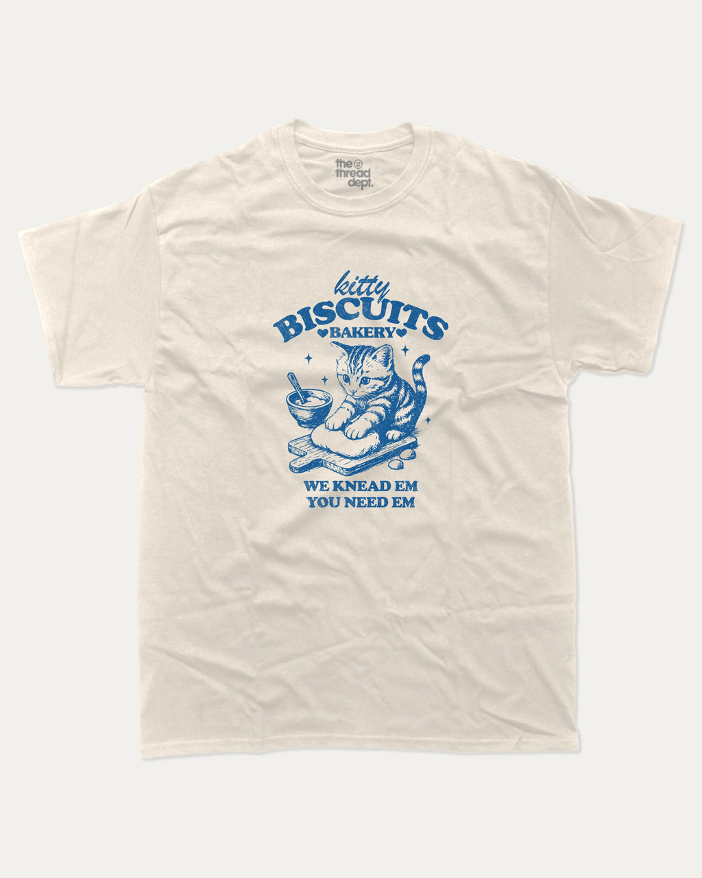 Kitty Biscuits Bakery graphic tee with bold and humorous print, funny and trendy graphic. Funny Cat Graphic T shirt, Gift for Cat Lover, Cat Graphic T shirt, Cute Cat tee, Perfect for adults and gift-giving. Cream shirt.