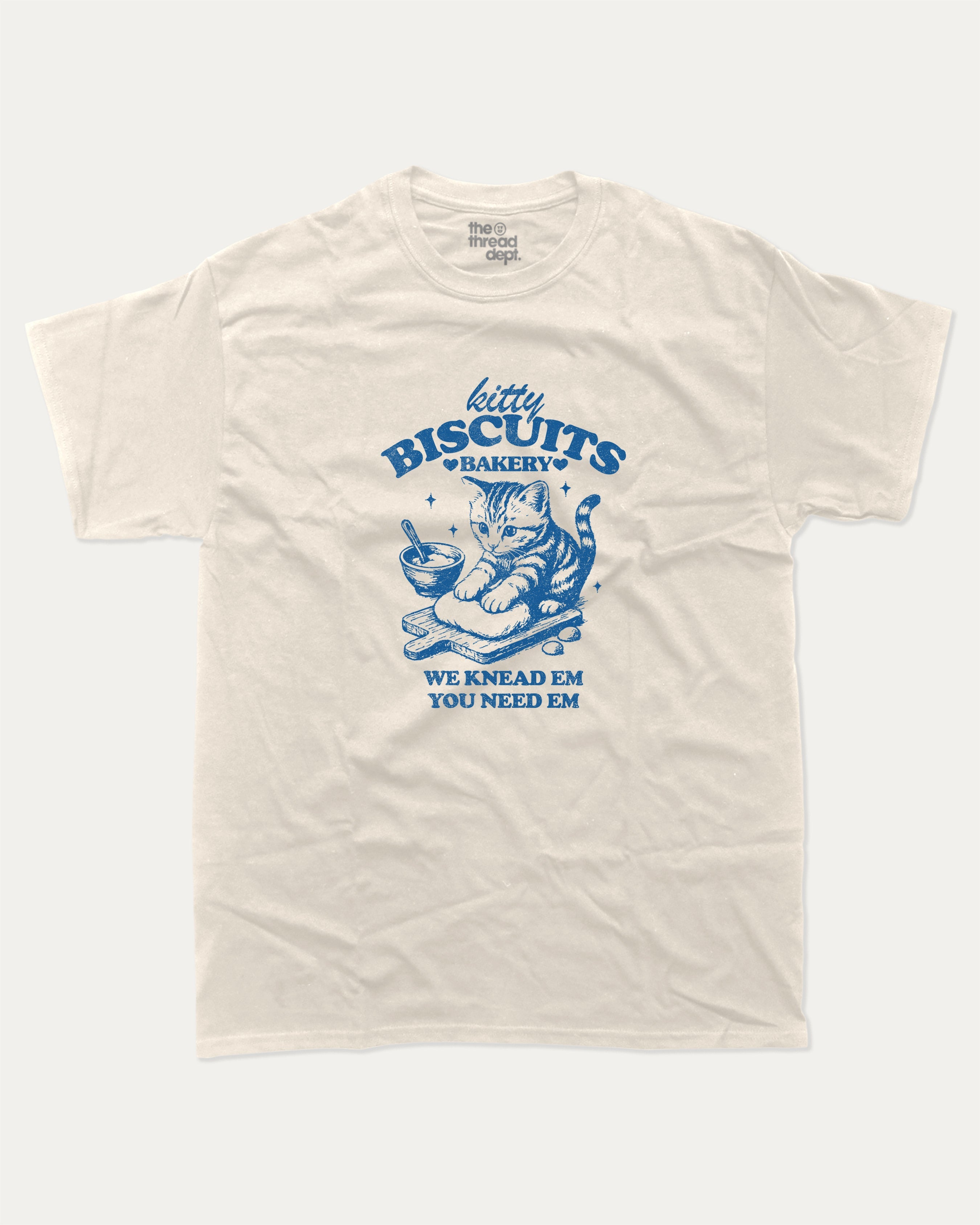 Kitty Biscuits Bakery graphic tee with bold and humorous print, funny and trendy graphic. Funny Cat Graphic T shirt, Gift for Cat Lover, Cat Graphic T shirt, Cute Cat tee, Perfect for adults and gift-giving. Cream shirt.