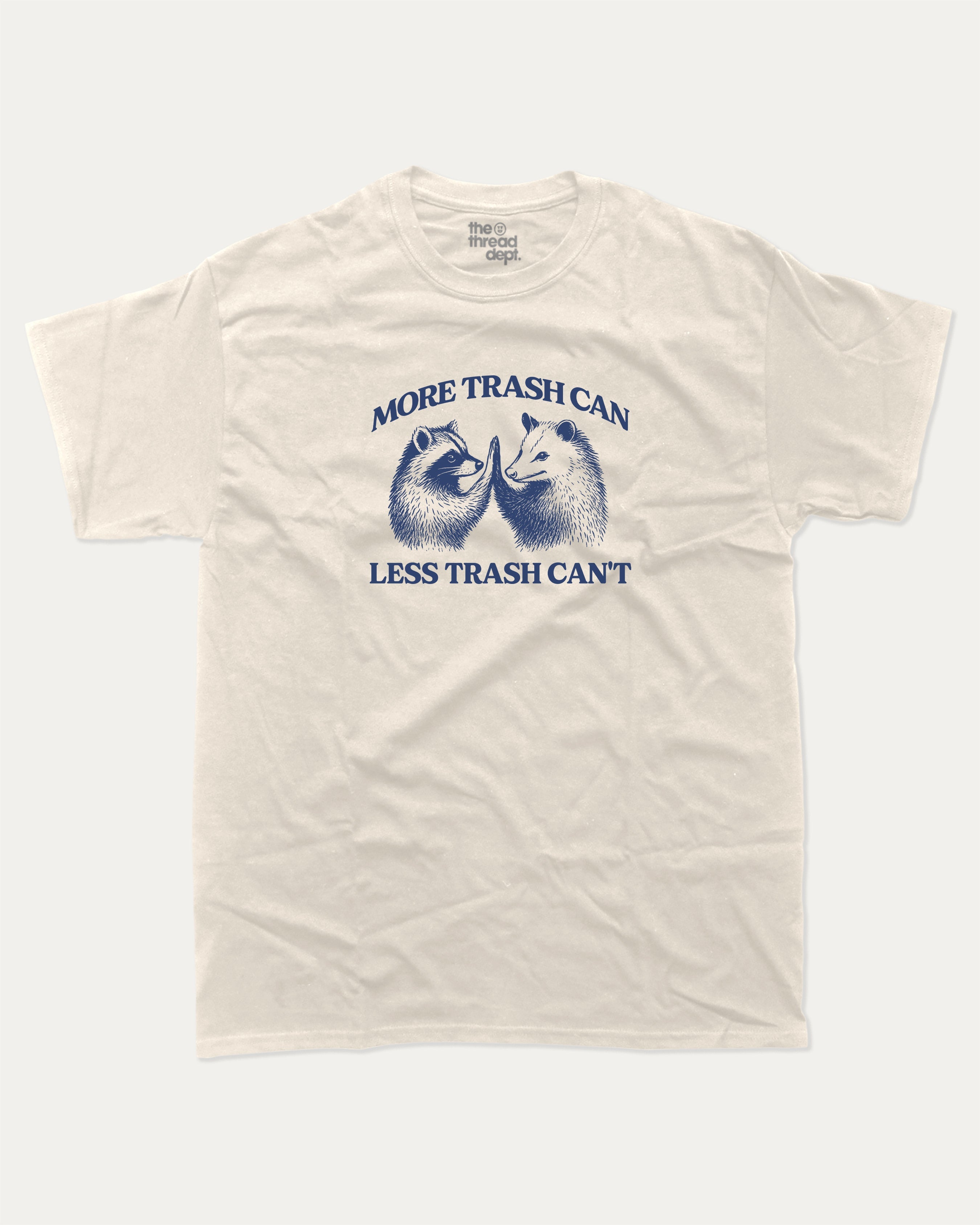 More trash can Less trash can't graphic tee with funny raccoon and possum print, funny and trendy graphic. Perfect for adults and gift-giving. Cream shirt.