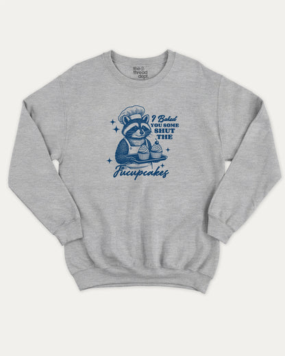 Shut The Fucupcakes Racoon pullover sweatshirt, Funny Animal Graphic T shirt, Humorous Animal T shirt, Cute Animal Graphic T shirt, A must-have graphic pullover, comfy cold-weather wear, bold casual look. Heather Grey sweater