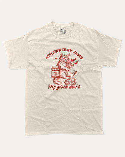 Strawberry Jams graphic tee with bold and humorous print, funny and trendy Animal Lover Graphic T shirt, Cat Lover Tee, Retro Animal Graphic T shirt, Retro Cat Graphic T shirt, Perfect for adults and gift-giving. Cream shirt.