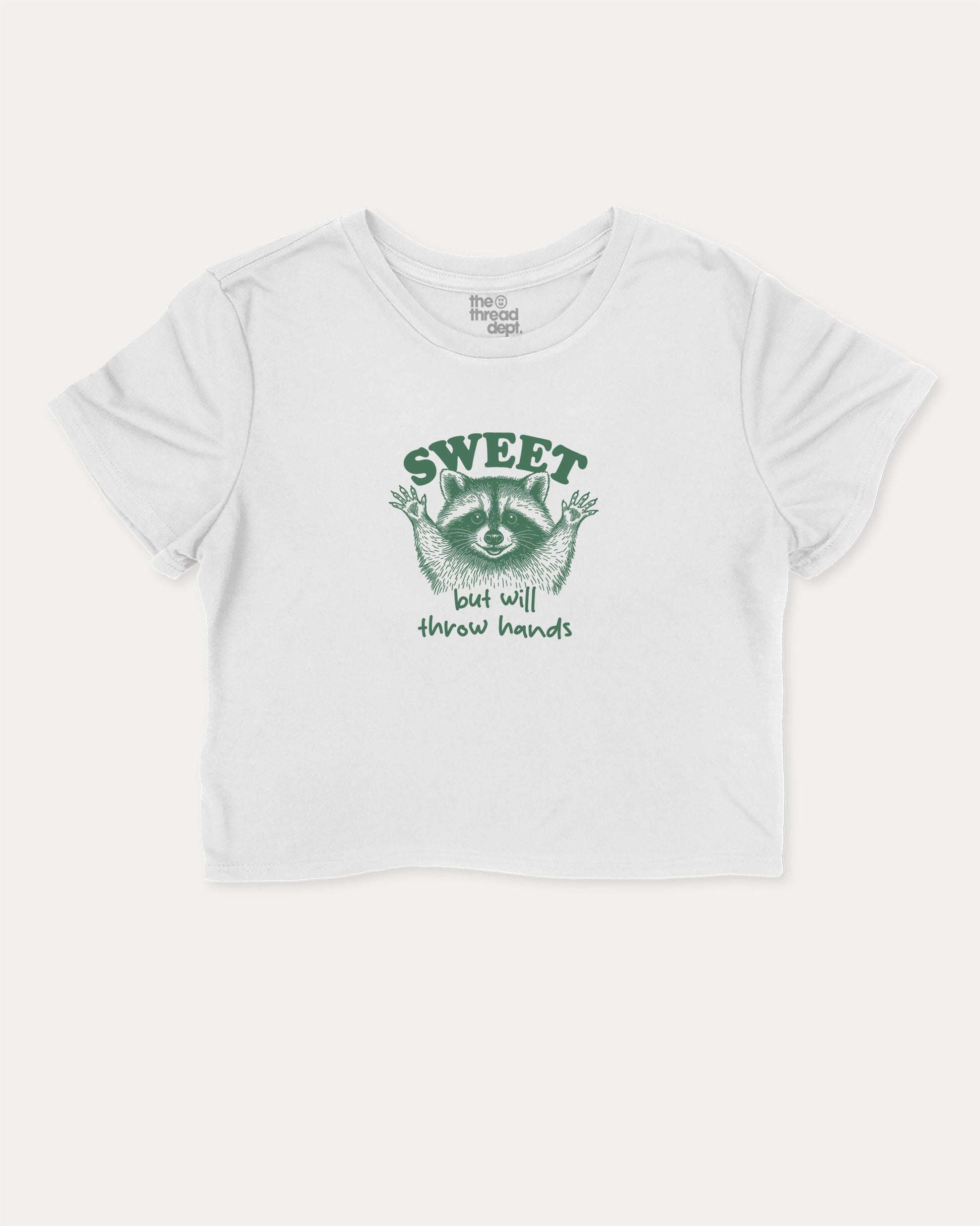 Sweet But Will Throw Hands Raccoon cute and trendy crop tee with raccoon graphic, perfect for women. A must-have cropped aesthetic shirt, ideal for daily outfits and casual days. White crop tee