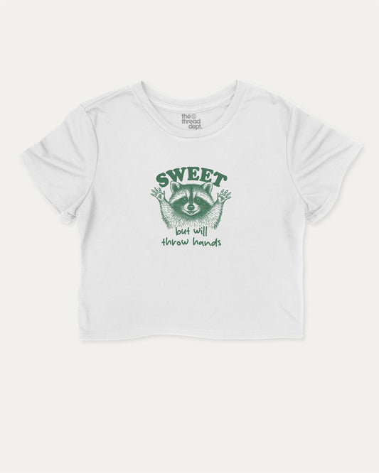 Sweet But Will Throw Hands Raccoon cute and trendy crop tee with raccoon graphic, perfect for women. A must-have cropped aesthetic shirt, ideal for daily outfits and casual days. White crop tee