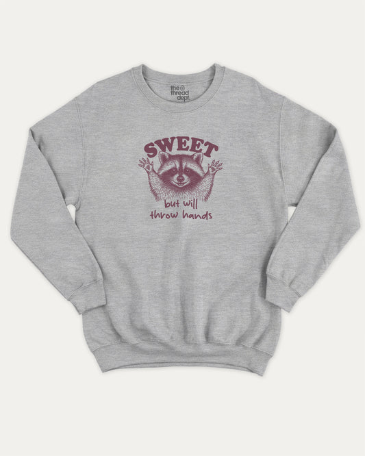 Sweet But Will Throw Hands Raccoon pullover sweatshirt, perfect for adults. Funny raccoon graphic pullover, comfy cold-weather wear, bold casual look. Heather Grey sweater