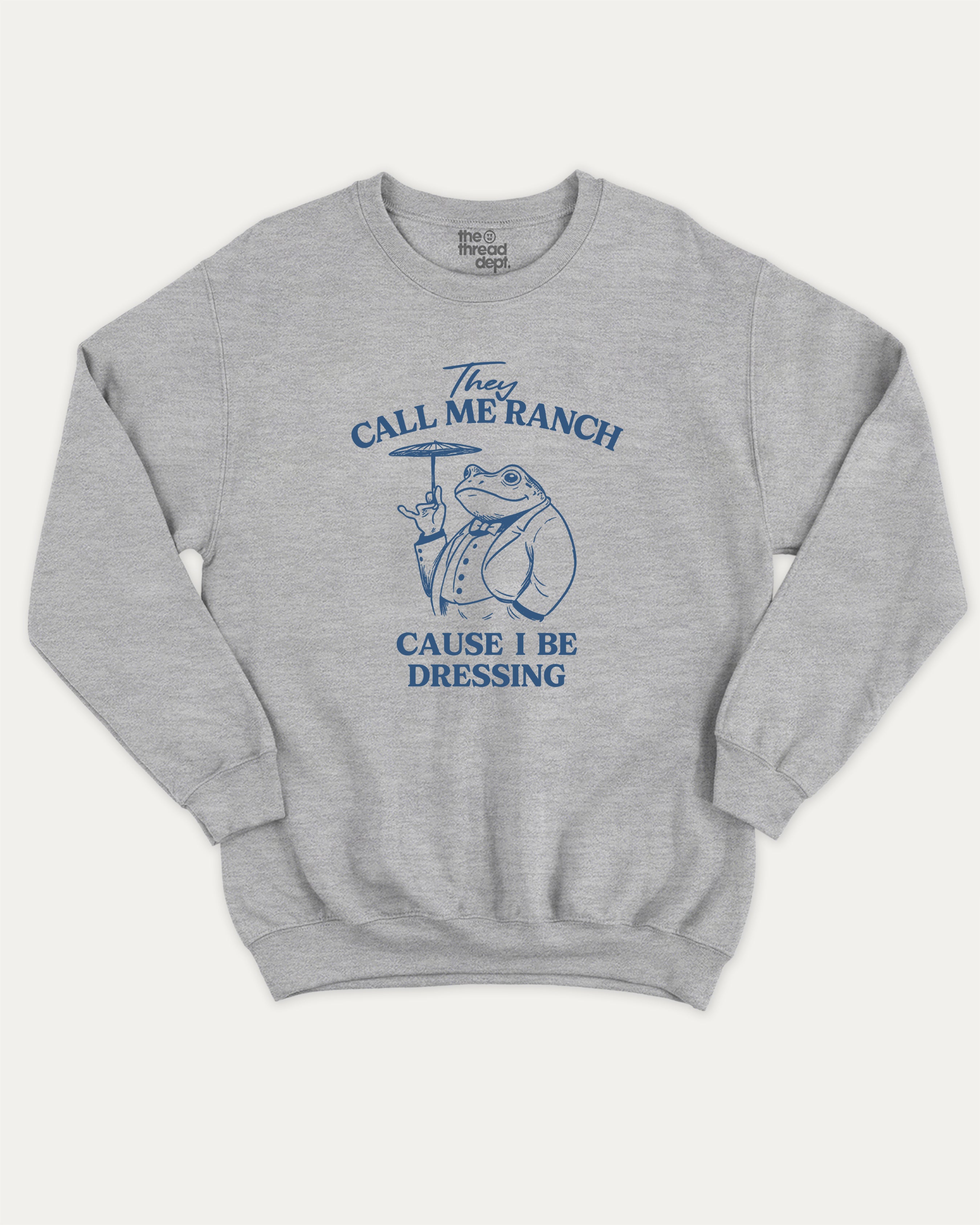 They Call Me Ranch Cause I Be Dressing graphic sweatshirt with funny frog print, warm and cozy graphic for everyday wear. Perfect for adults and gift-giving. Heather Grey pullover.