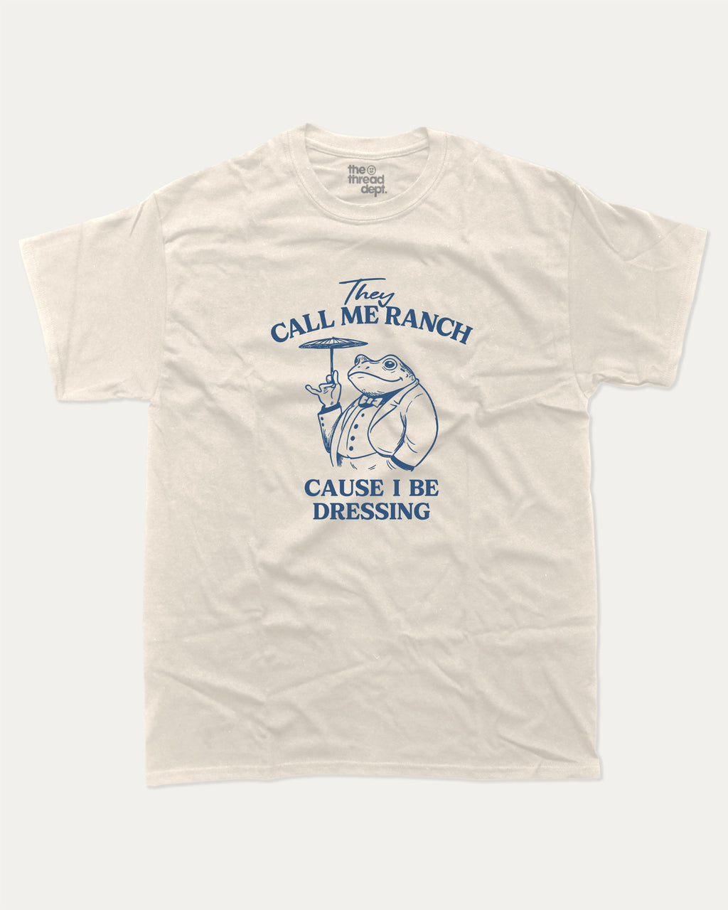 They Call Me Ranch Cause I Be Dressing graphic tee with funny frog print, funny and trendy graphic. Perfect for adults and gift-giving. Cream shirt.