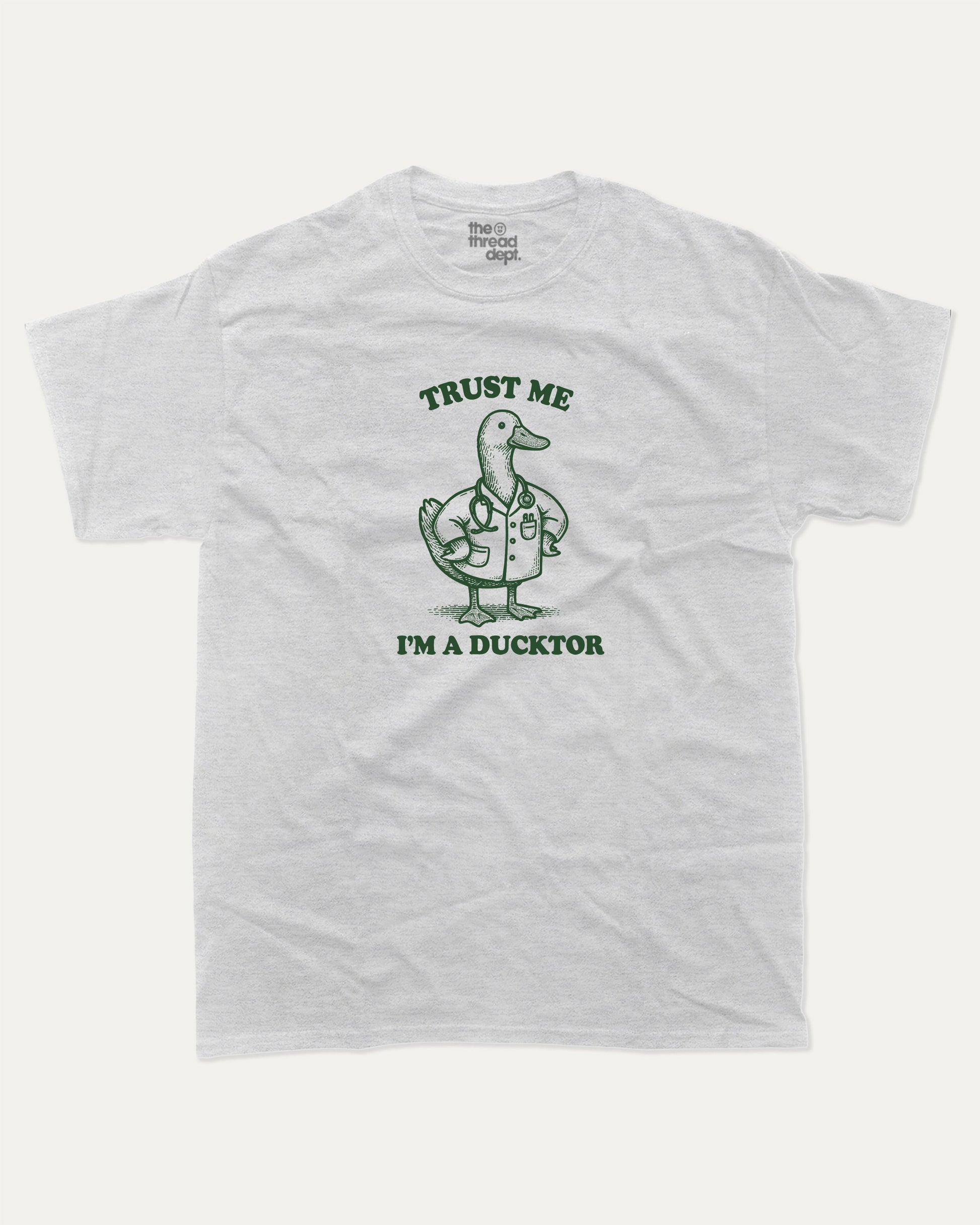 Trust Me I'm A Ducktor graphic t-shirt, perfect for gifts. Funny duck graphic tee, trending meme shirt, unique gift idea. Ash Grey .