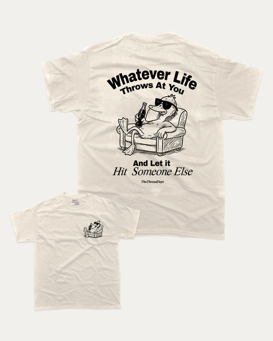 Whatever Life Throws At You Duck And Let Hit Someone Else graphic t-shirt, perfect for friends. A must-have funny duck tee, trending meme shirt, unique gift idea. Cream.