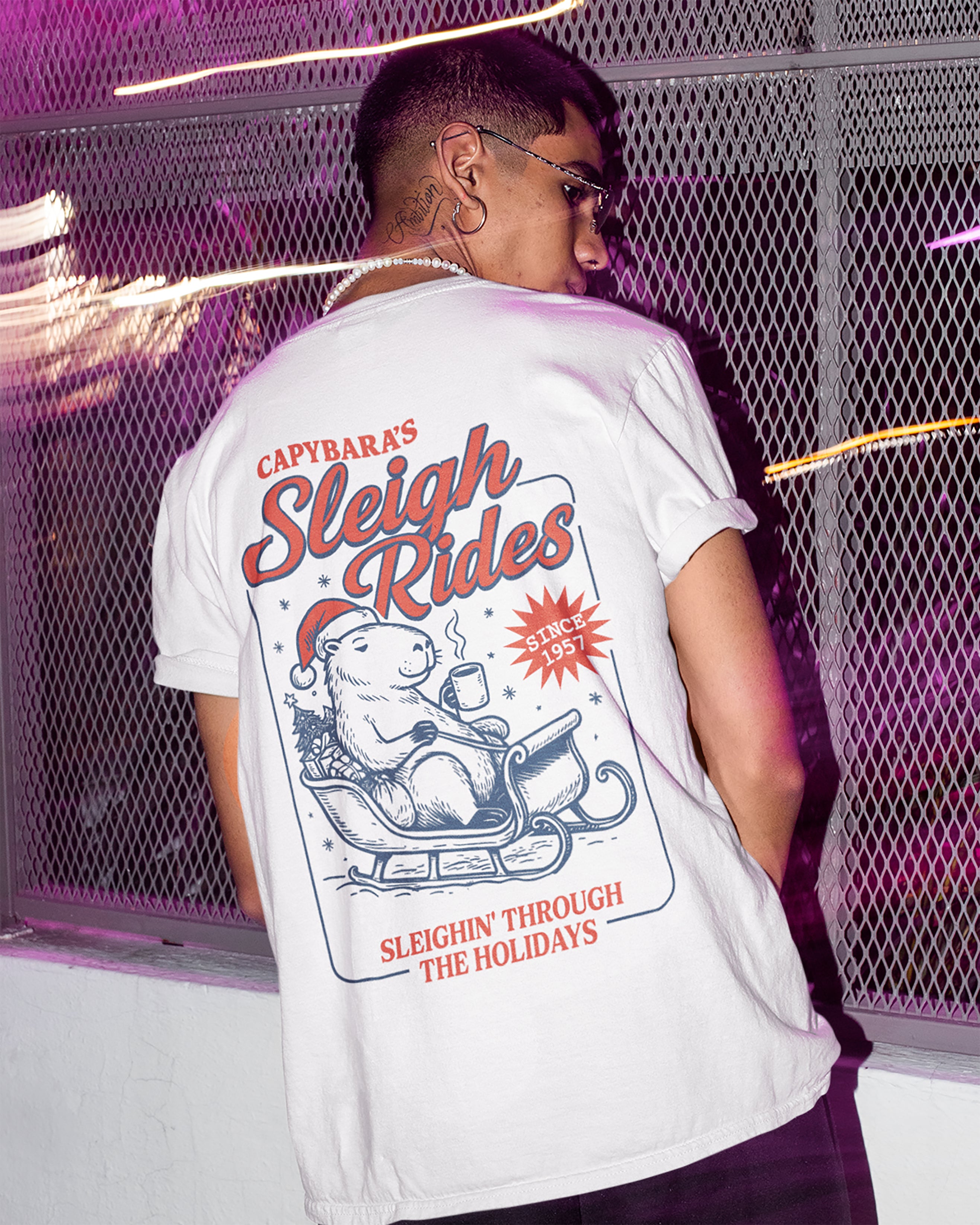 Capybara's Sleigh Rides graphic tee with bold and humorous print. Best Christmas gifts.