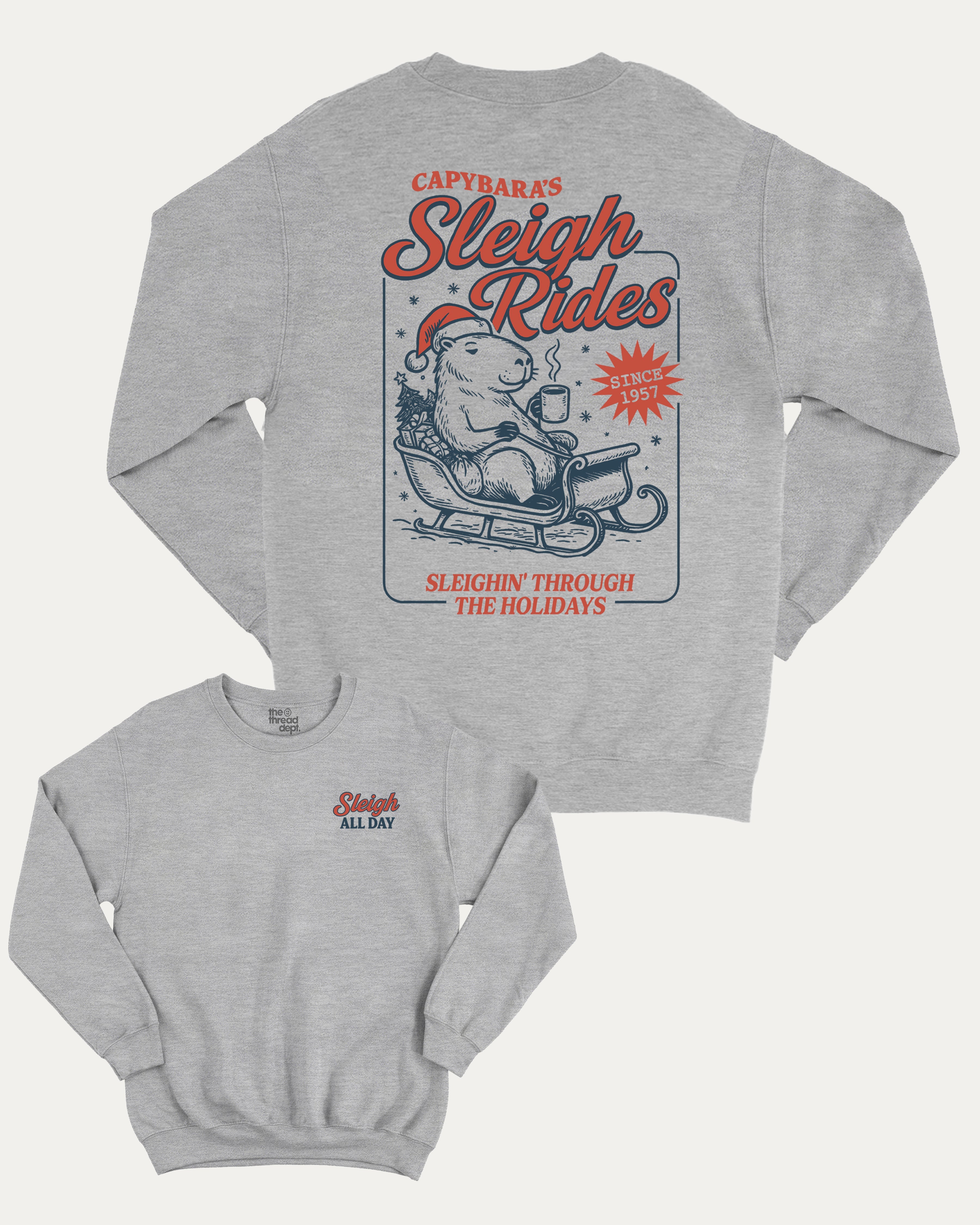 Capybara's Sleigh Rides graphic sweatshirt with bold and humorous print, Perfect Gift for Christmas, X Mas Graphic T shirt, X-mas Gift, warm and cozy graphic for everyday wear. Perfect for adults and gift-giving. Heather Grey pullover.