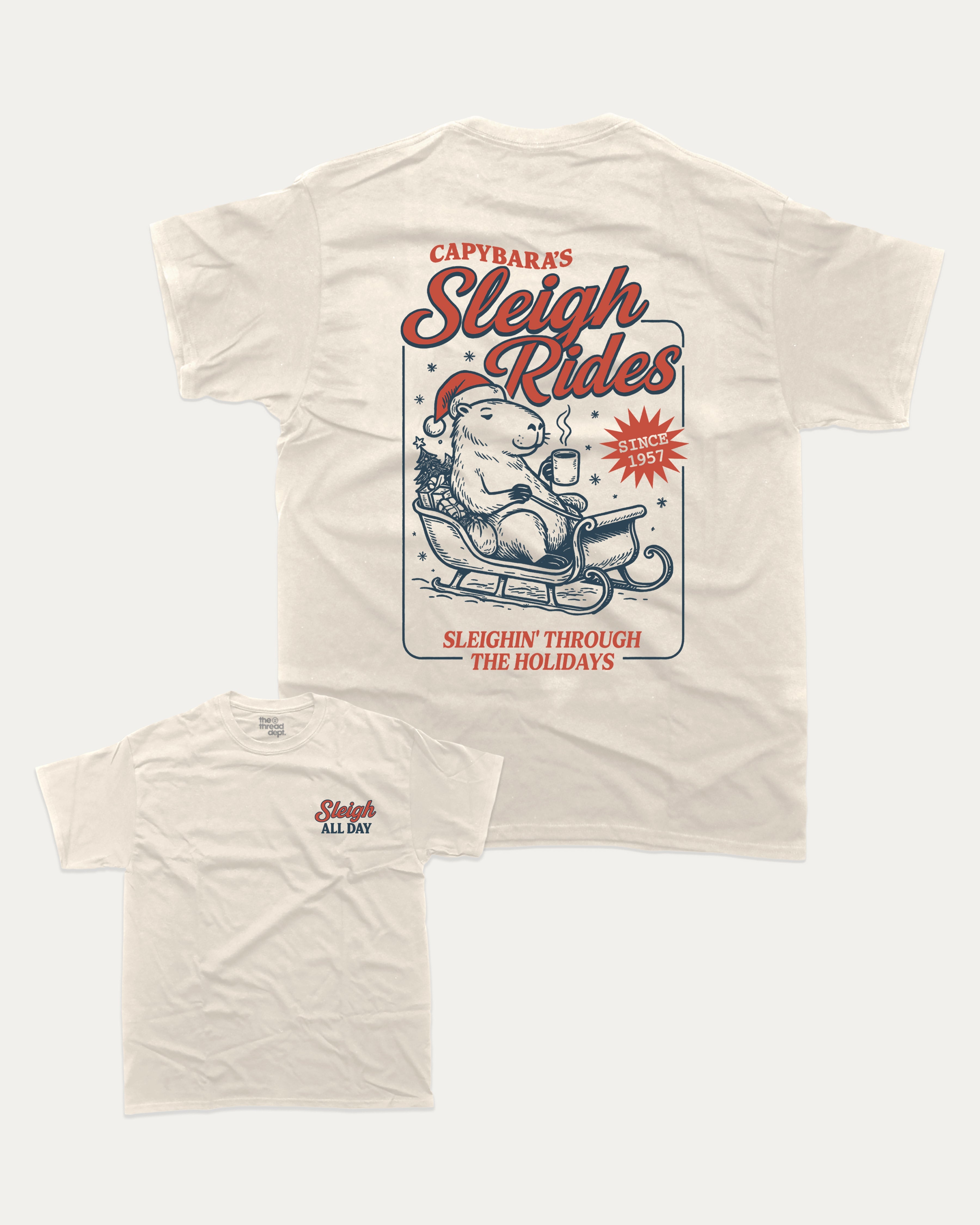 Capybara's Sleigh Rides graphic tee with bold and humorous print, Perfect Gift for Christmas, X Mas Graphic T shirt, X-mas Gift, funny and trendy graphic. Perfect for adults and gift-giving. Cream shirt.